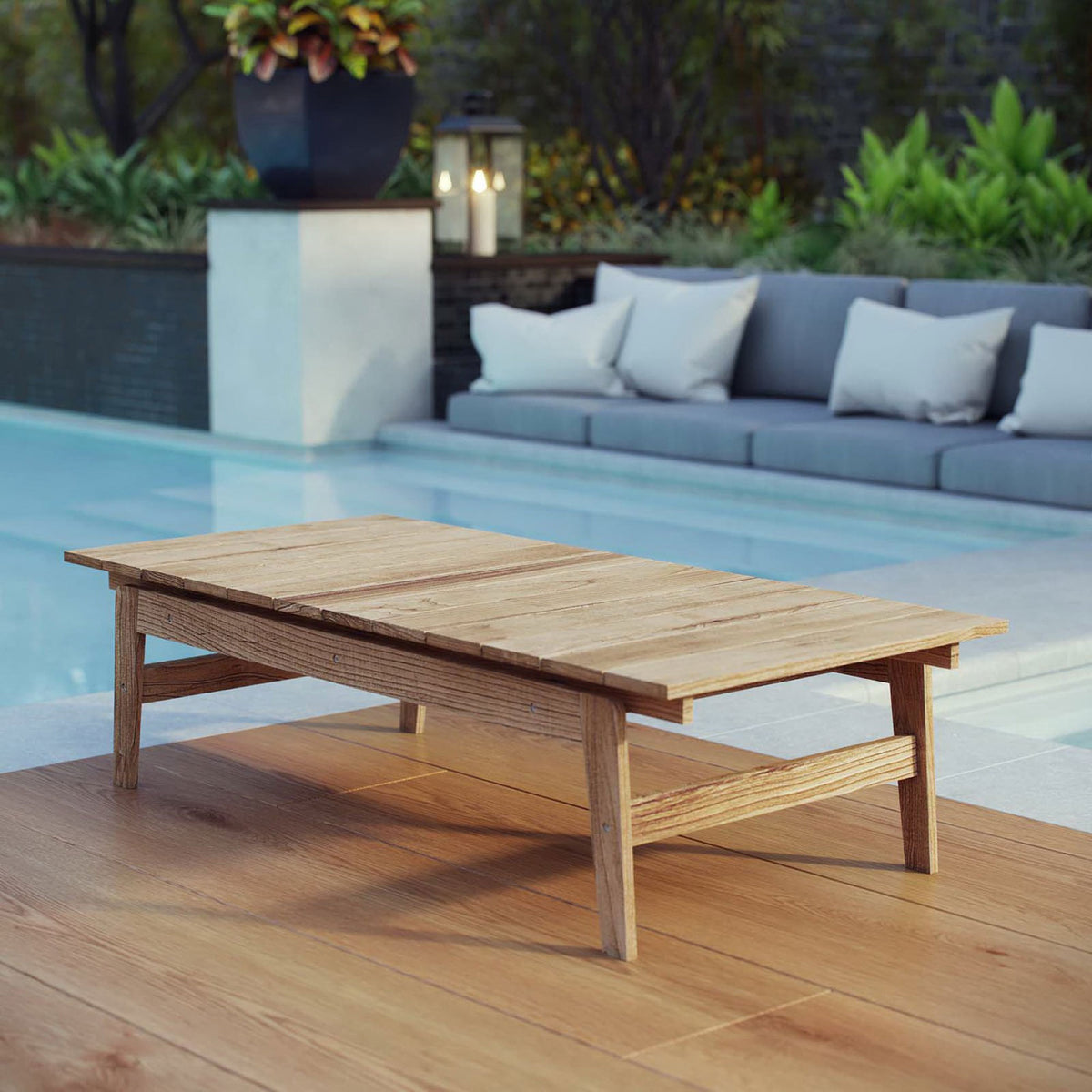 Teak outdoor coffee table styled poolside with modern seating for a relaxed lounge retreat || EEI-2699-NAT || front_angle_room