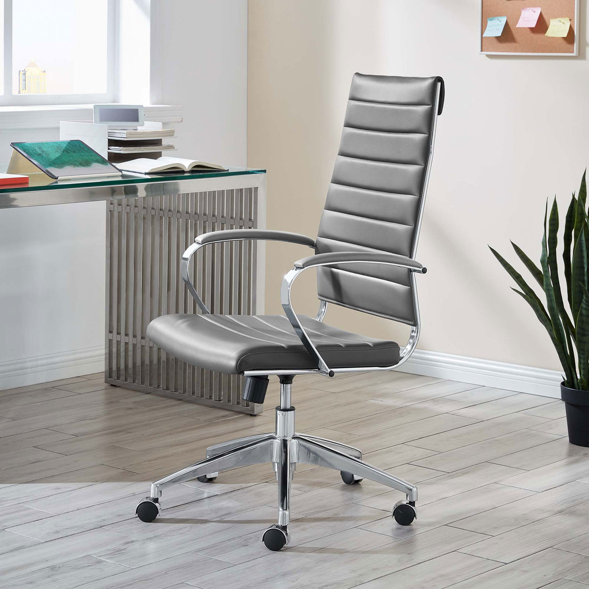 Gray Jive high back office chair on casters styled in a bright home office with glass desk and plant || EEI-272-GRY || front_angle_room
