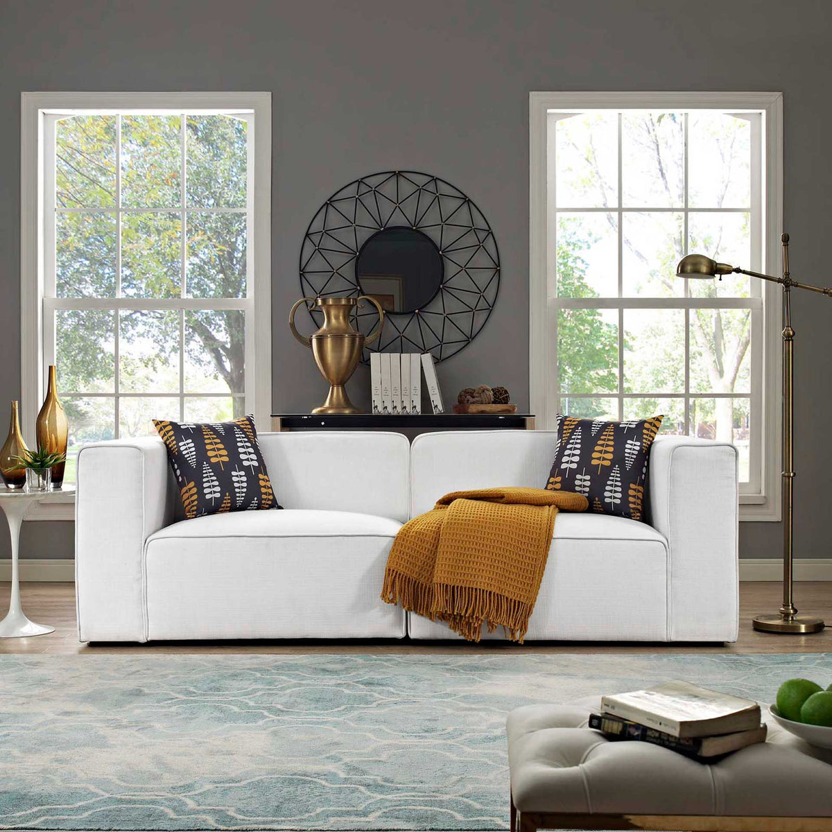 A white two-piece sofa brings roomy, cushioned seating and a crisp look to the living room