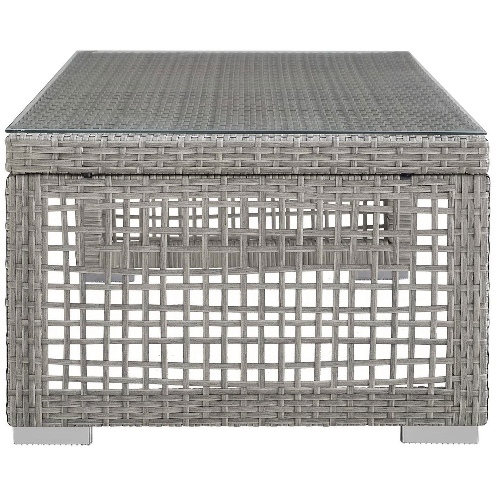 Low-profile gray rattan patio coffee table showcasing woven grid side panels and chrome-finished block feet || EEI-2919-GRY || side_studio