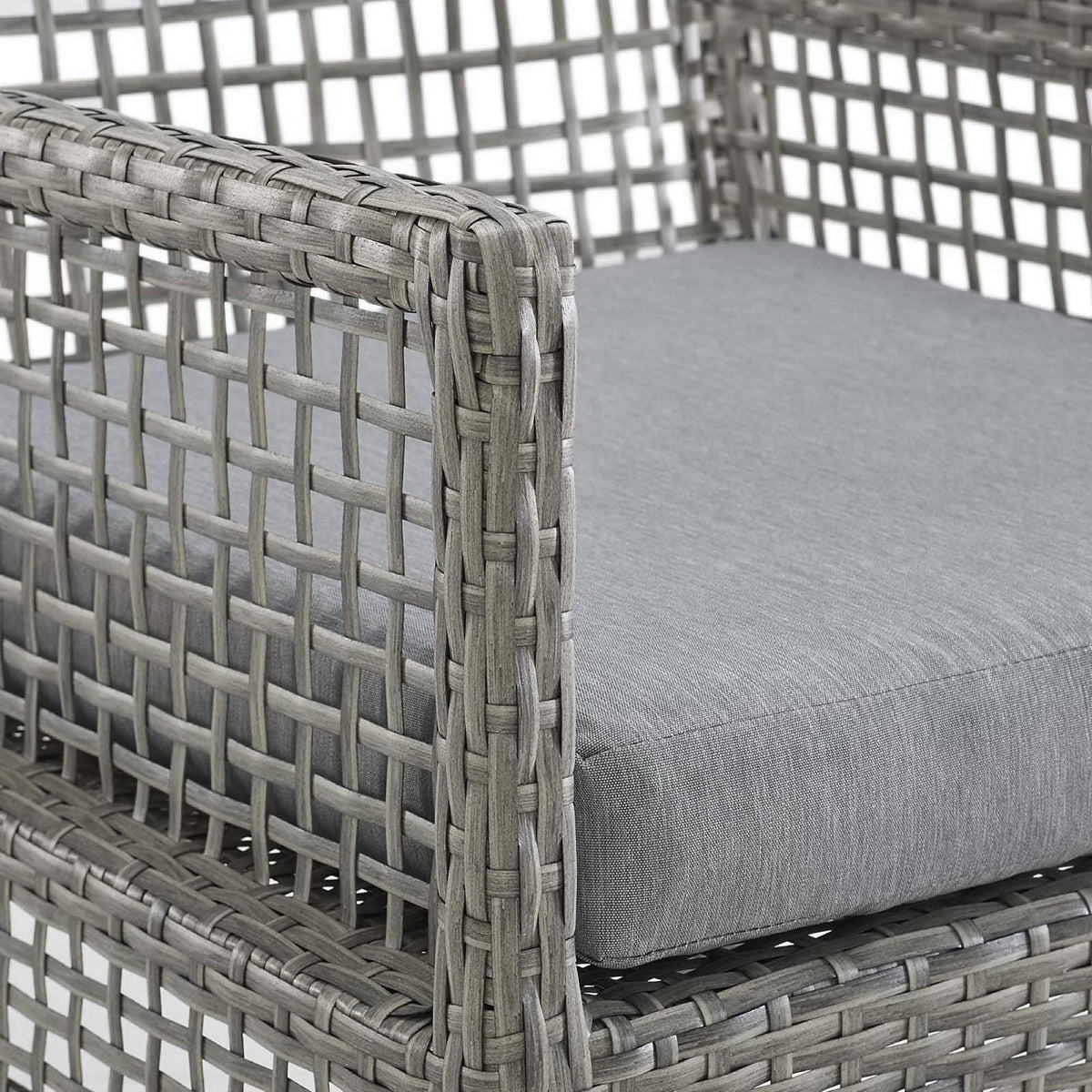 Thick gray all-weather cushion and tightly woven wicker trim showcase the chair's comfort and durability || EEI-2920-GRY-GRY || detail_studio