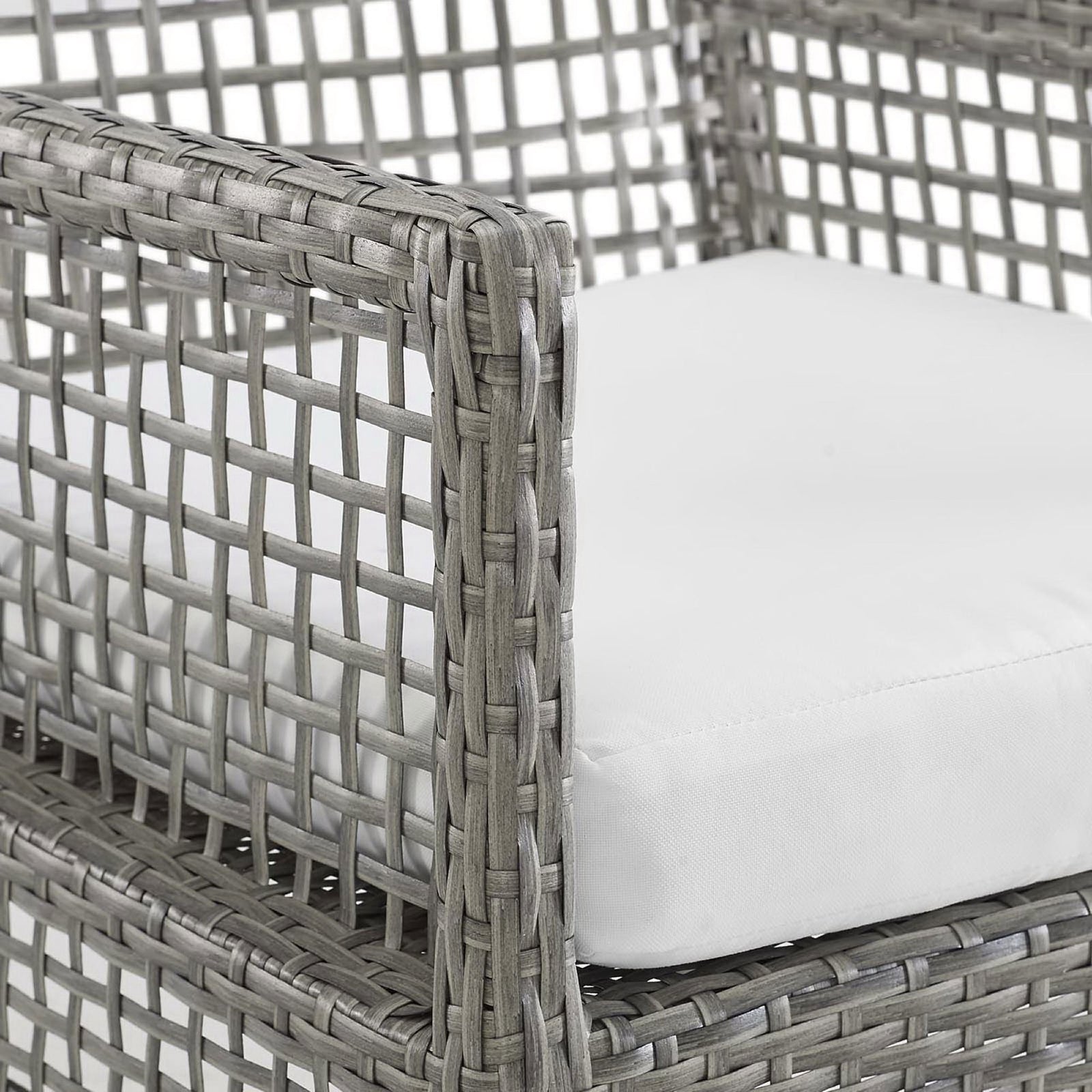 Soft white cushion and textured gray wicker arm detail highlight the chair's comfort and tactile weave || EEI-2920-GRY-WHI || detail_studio
