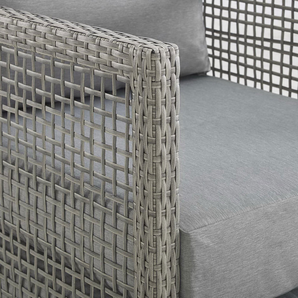 Woven gray rattan frame with smooth cushion fabric, emphasizing the texture and craftsmanship || EEI-2923-GRY-GRY || detail_studio