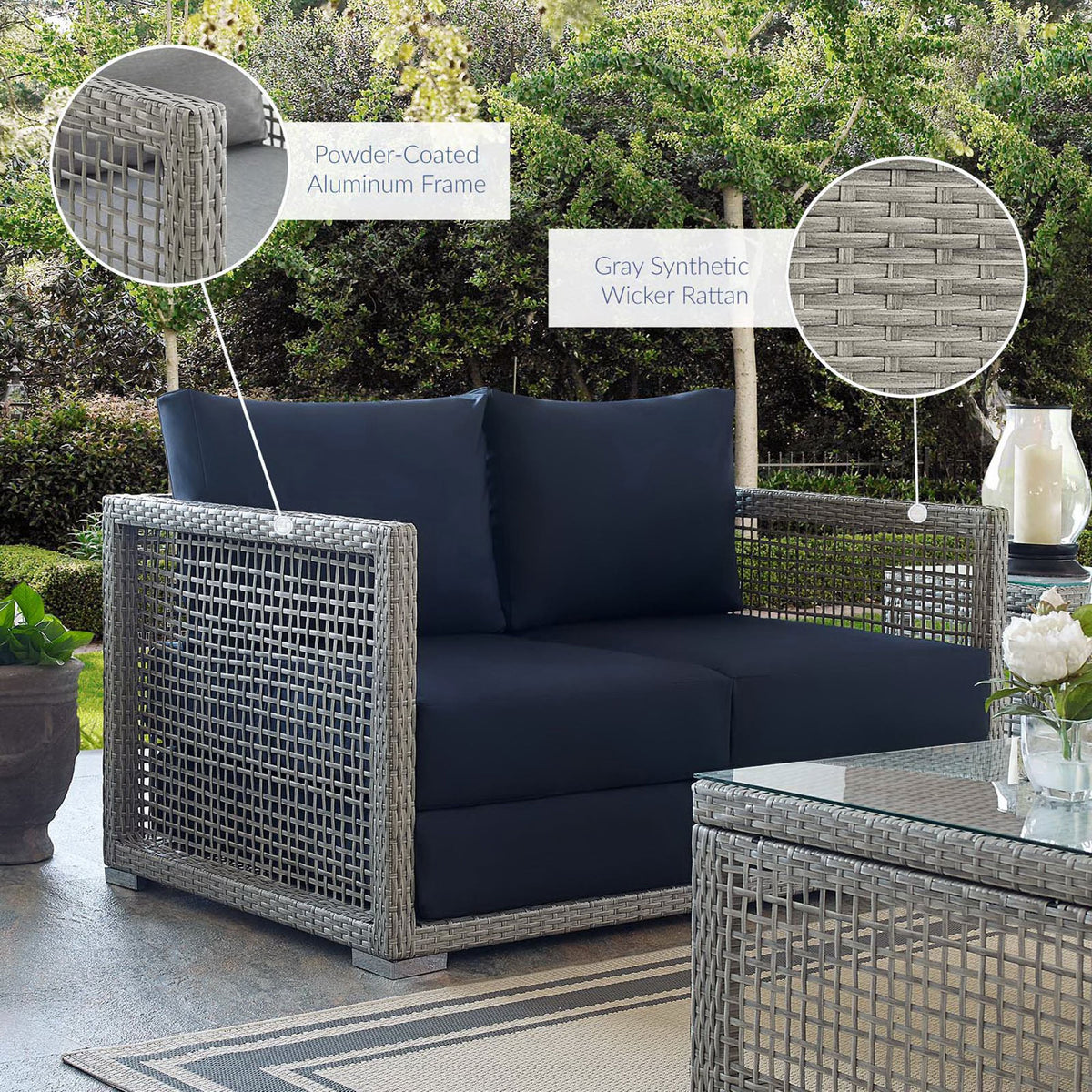 Aura gray wicker loveseat with navy cushions on patio highlighting features || EEI-2924-GRY-NAV || callout_room