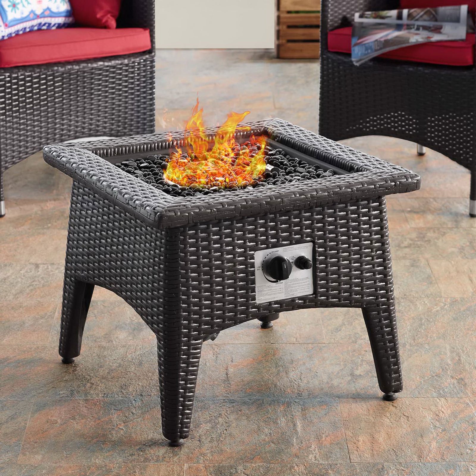 Outdoor seating area featuring espresso wicker fire pit table with bright flames || EEI-2990-EXP || front_angle_on_room