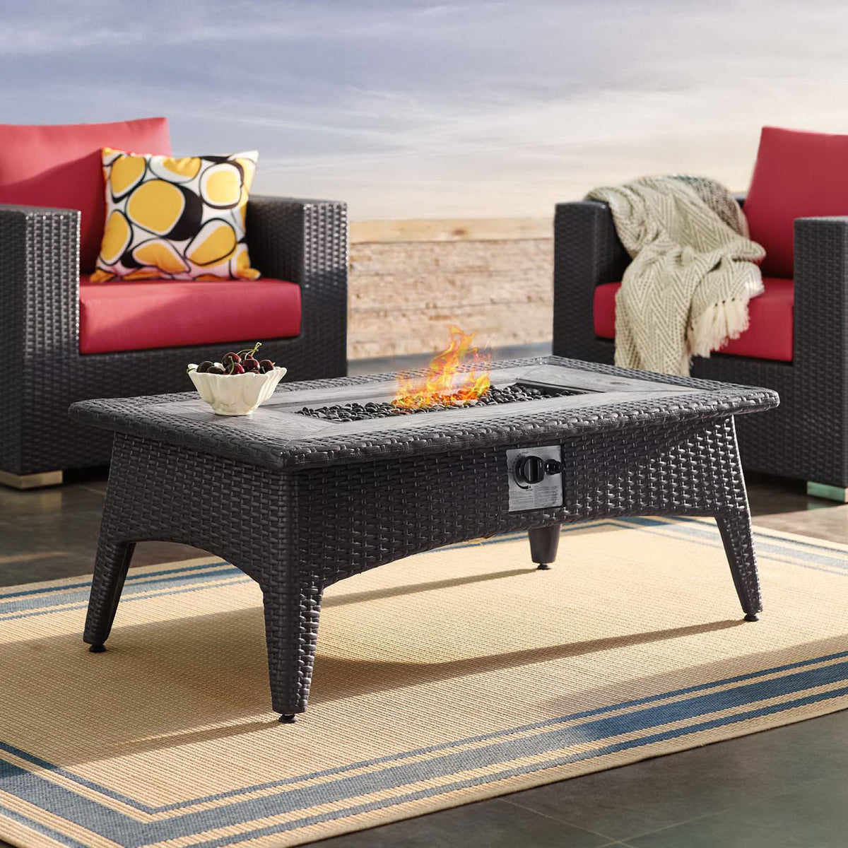 Espresso fire pit table creating a warm focal point between coordinating patio armchairs || EEI-2991-EXP || front_angle_on_room