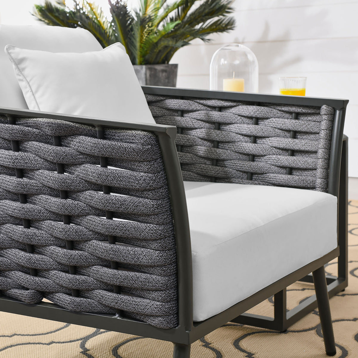 Woven charcoal rope texture and bright white cushions of the Stance outdoor armchair || EEI-3054-GRY-WHI || detail_room