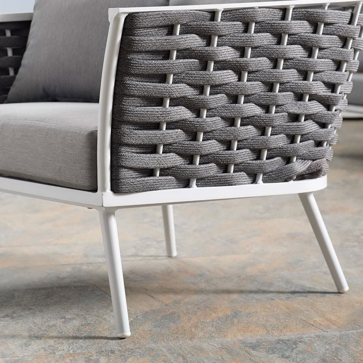 White tapered leg and woven rope texture of the Stance gray outdoor armchair on tile || EEI-3054-WHI-GRY || leg_room