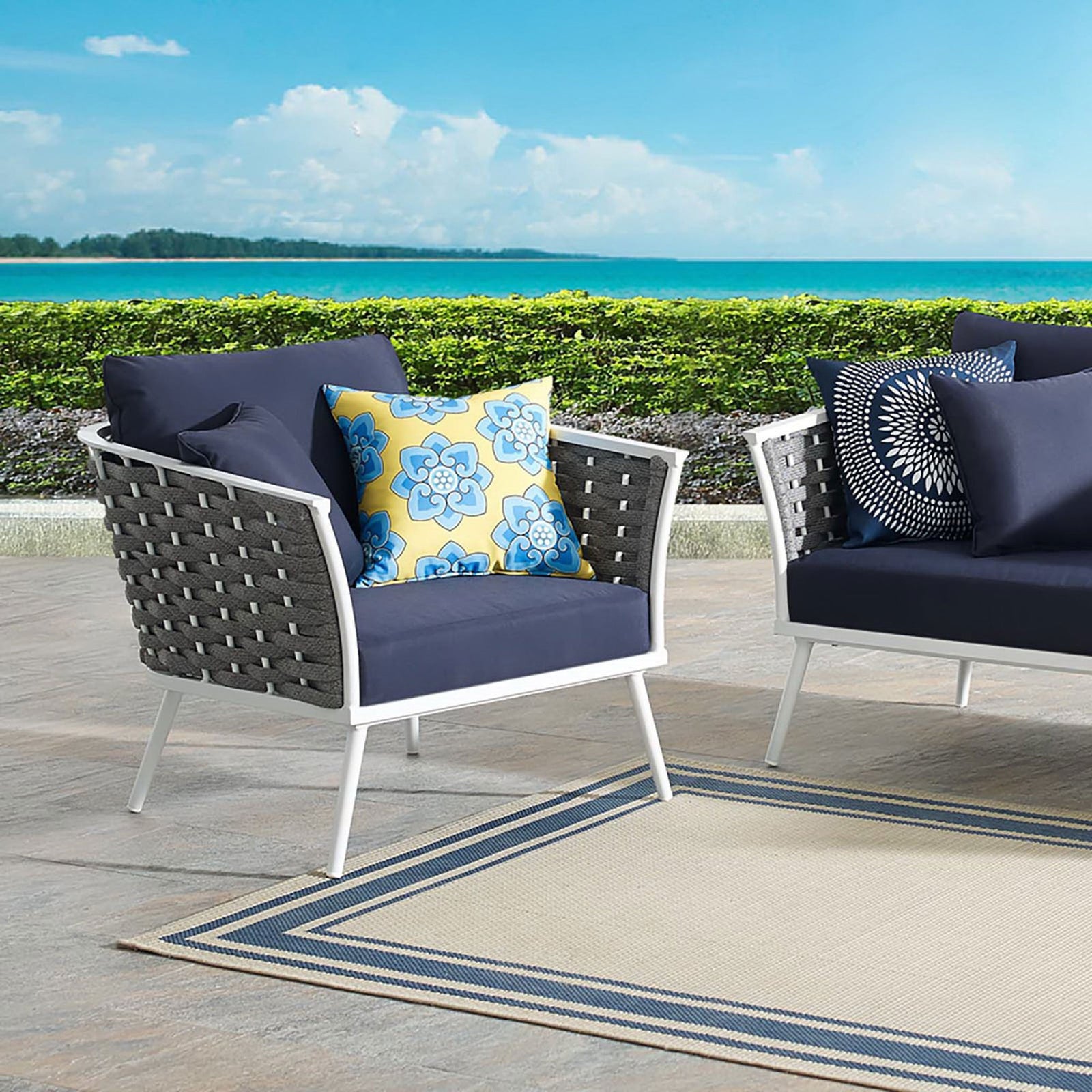 Stance outdoor armchair with navy cushions and rope sides arranged on a sunny patio || EEI-3054-WHI-NAV || front_angle_room