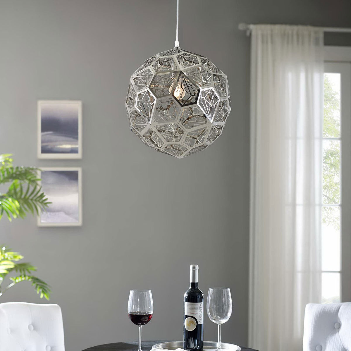 Modern geometric pendant chandelier illuminating a contemporary dining nook || EEI-3082 || front_on_room