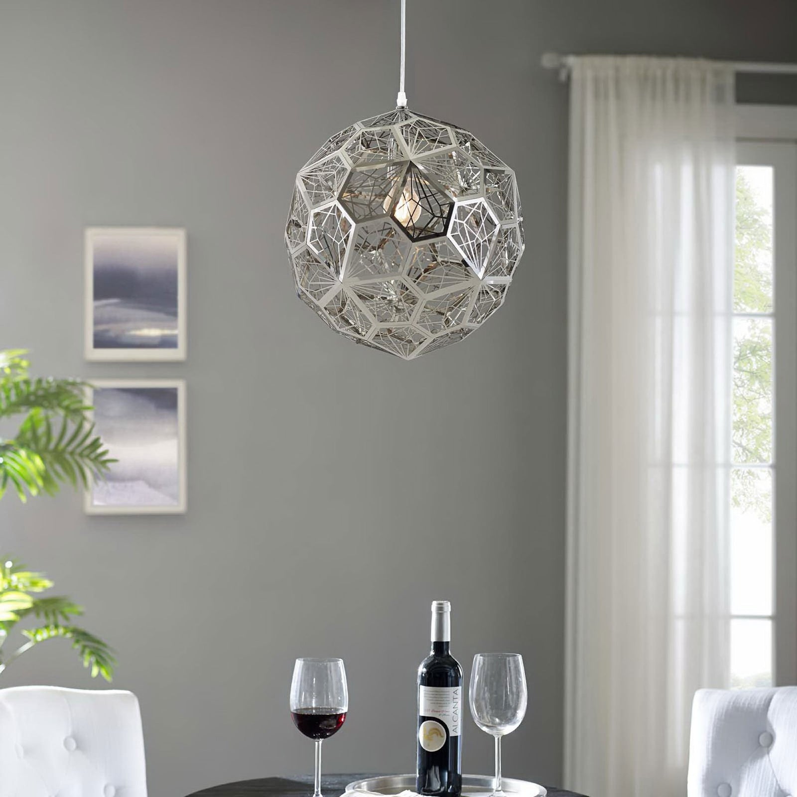 Modern geometric pendant chandelier illuminating a contemporary dining nook || EEI-3082 || front_on_room