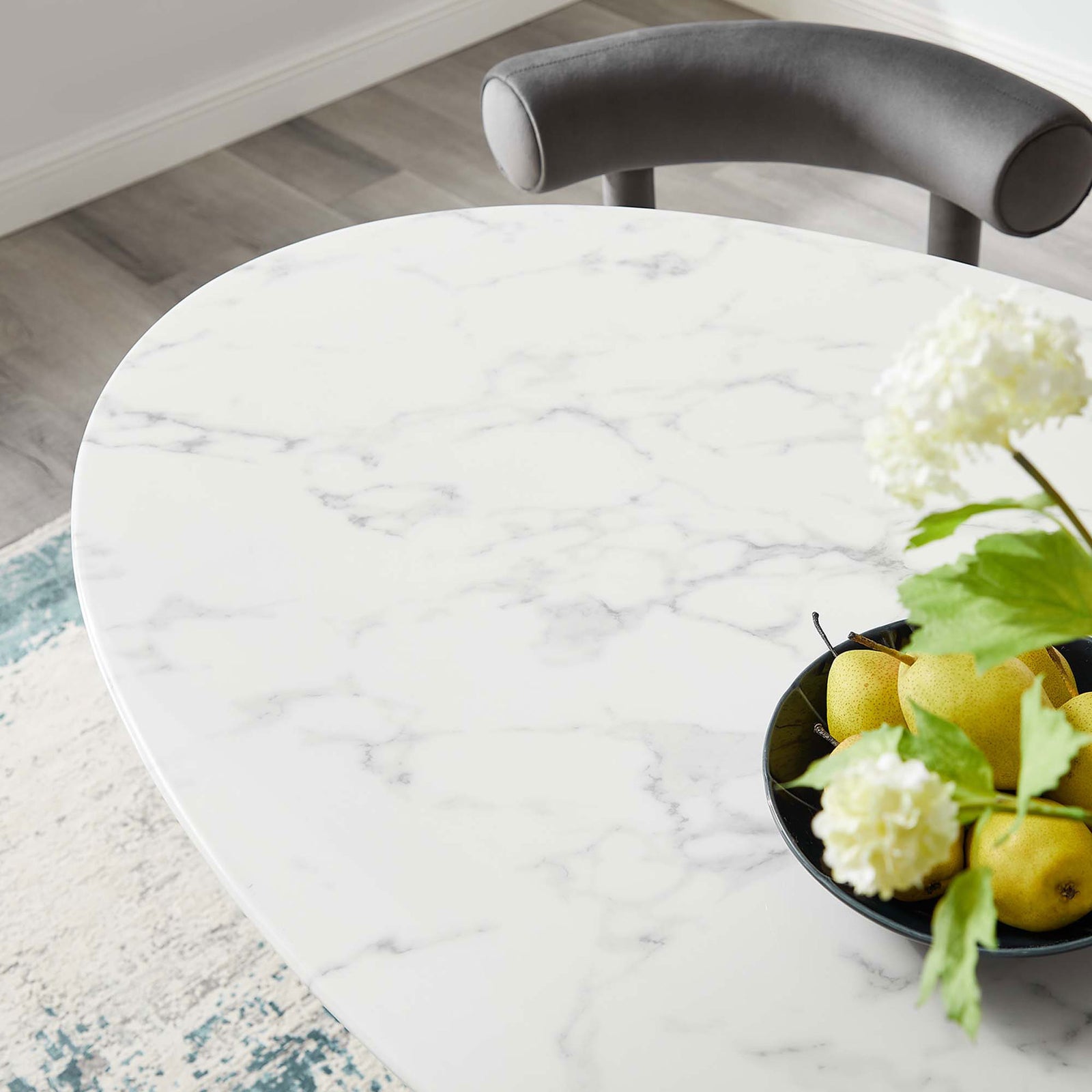 Faux marble tabletop styled with bowl of lemons and flowers for fresh dining decor || EEI-3235-GLD-WHI || detail_room