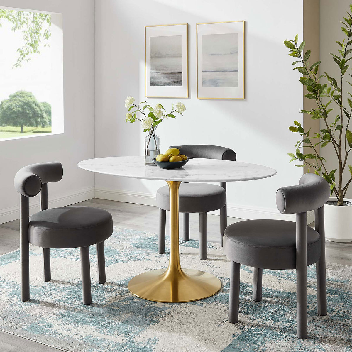 White faux marble dining table with gold pedestal base set with gray chairs in a contemporary dining room || EEI-3235-GLD-WHI || front_angle_room