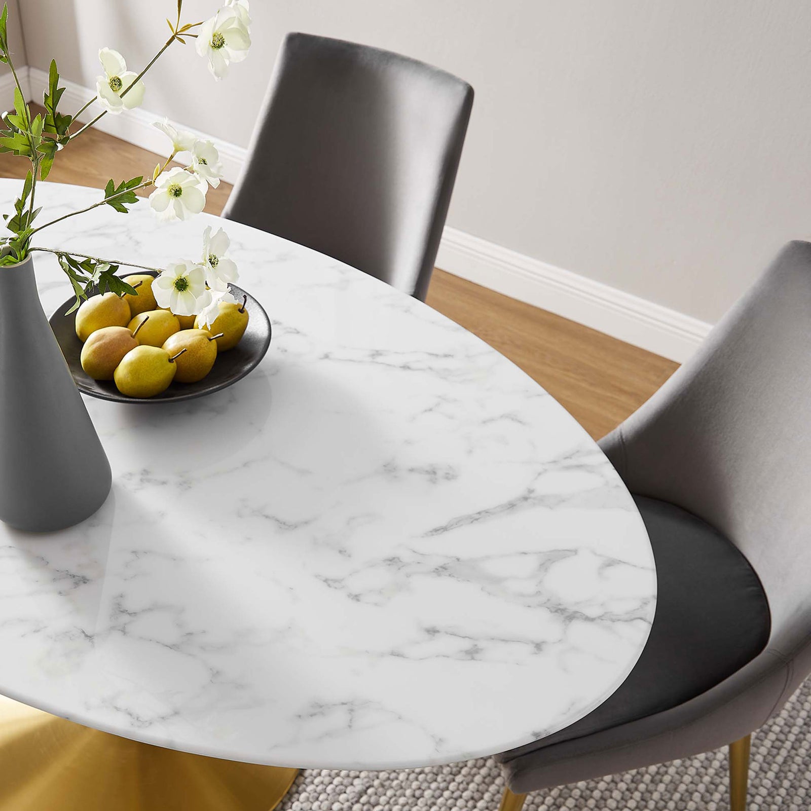 Faux marble tabletop accented with vase and fruit bowl to highlight the smooth glossy surface || EEI-3236-GLD-WHI || detail_room