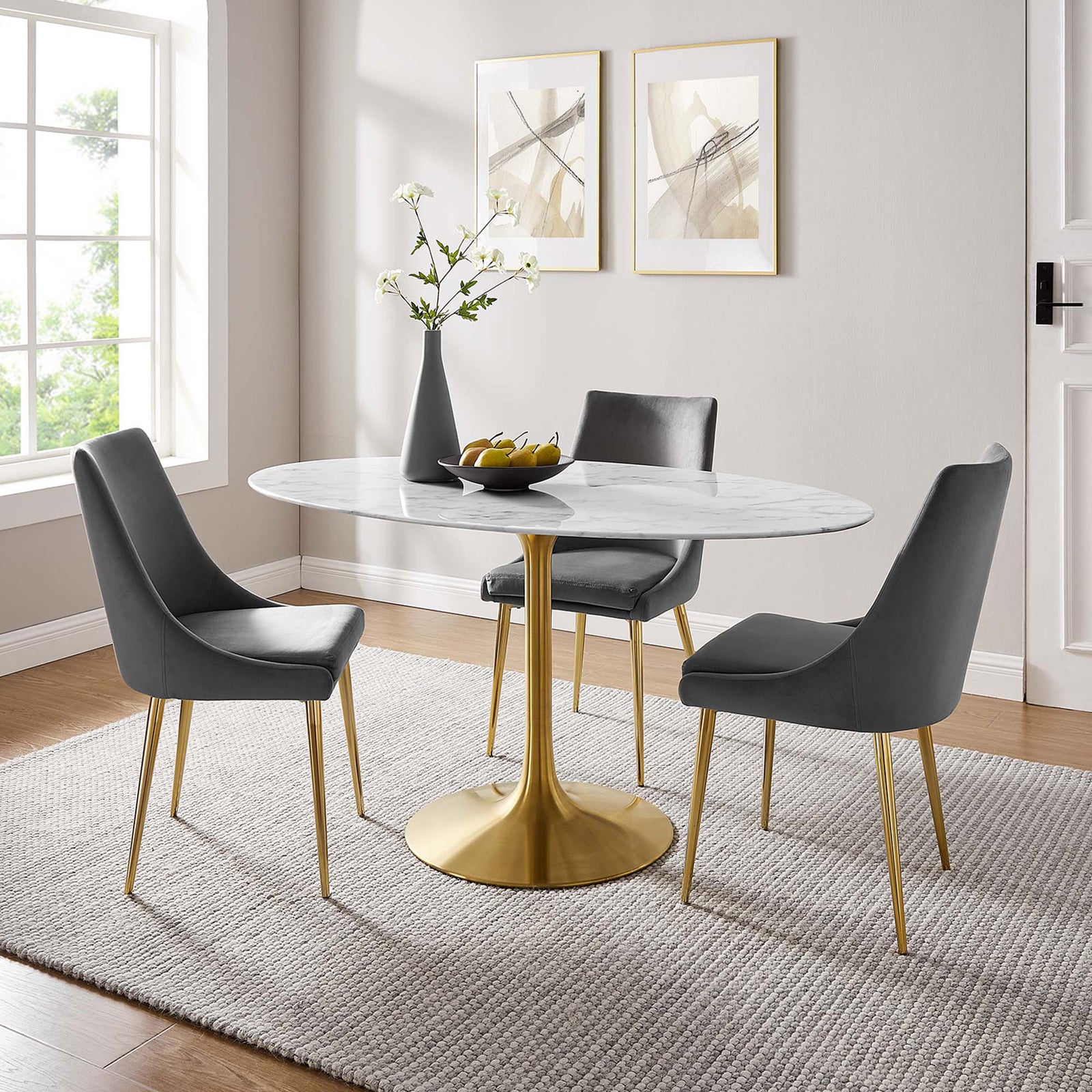 White faux marble dining table with gold pedestal base arranged with gray chairs in a warm dining room || EEI-3236-GLD-WHI || front_angle_room