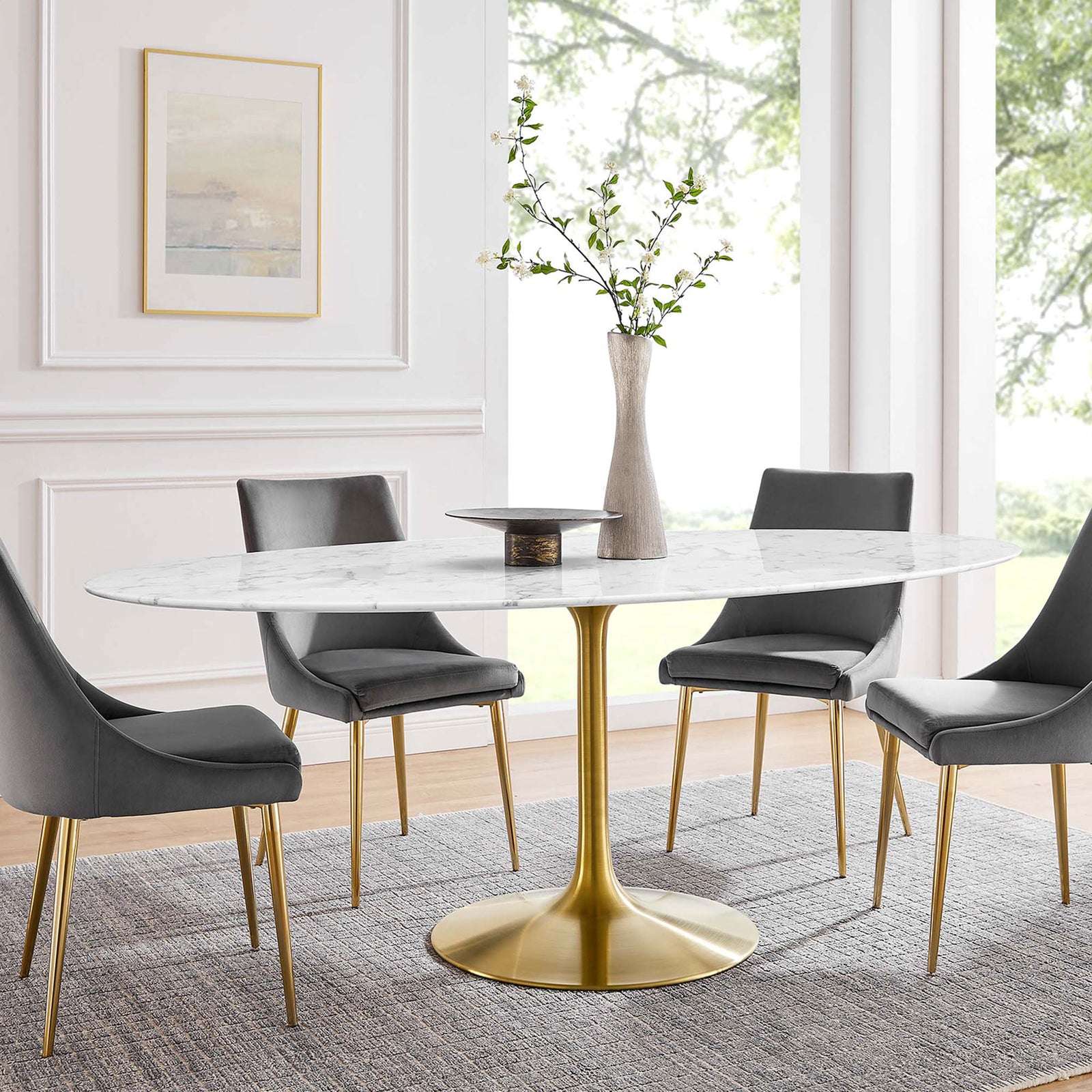 White faux marble dining table with gold pedestal base styled with gray chairs in an elegant dining room || EEI-3257-GLD-WHI || front_angle_room