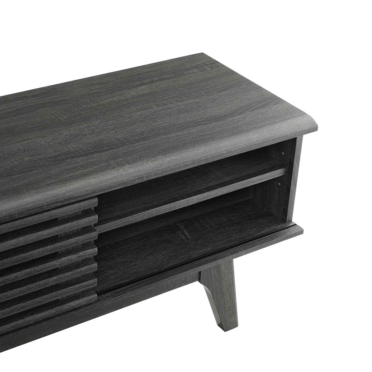 Detail of charcoal wood-grain top, open shelf, and flared leg of the Render entertainment console || EEI-3303-CHA || detail_studio