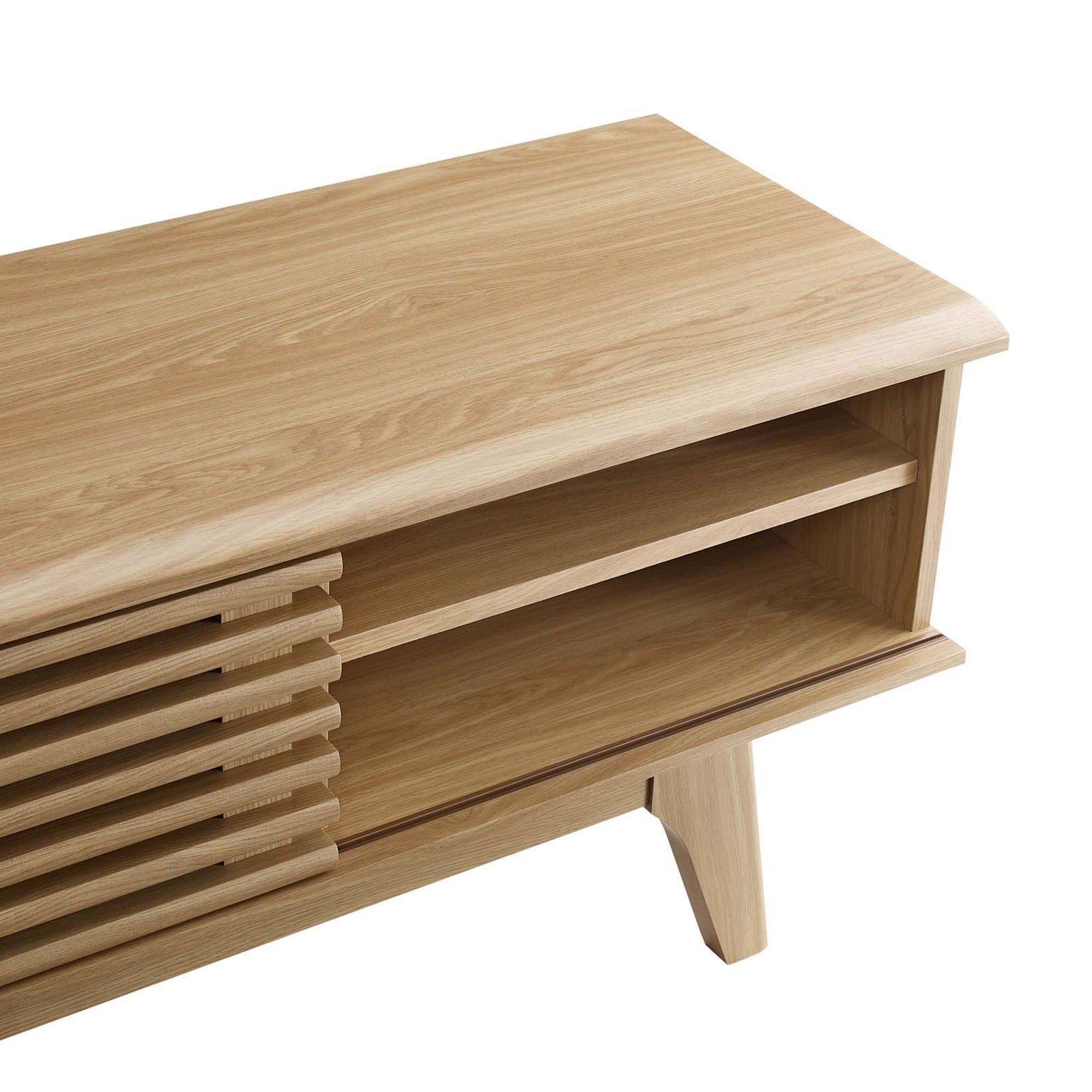Detail of oak wood-grain top, open shelf, and tapered leg of the Render 70 inch media console || EEI-3303-OAK || detail_studio