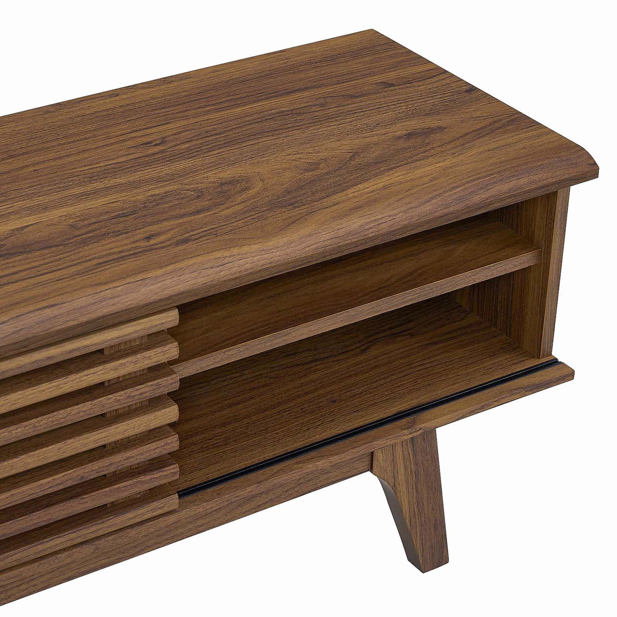 Detail of walnut wood-grain top, adjustable shelf, and tapered leg of the media console