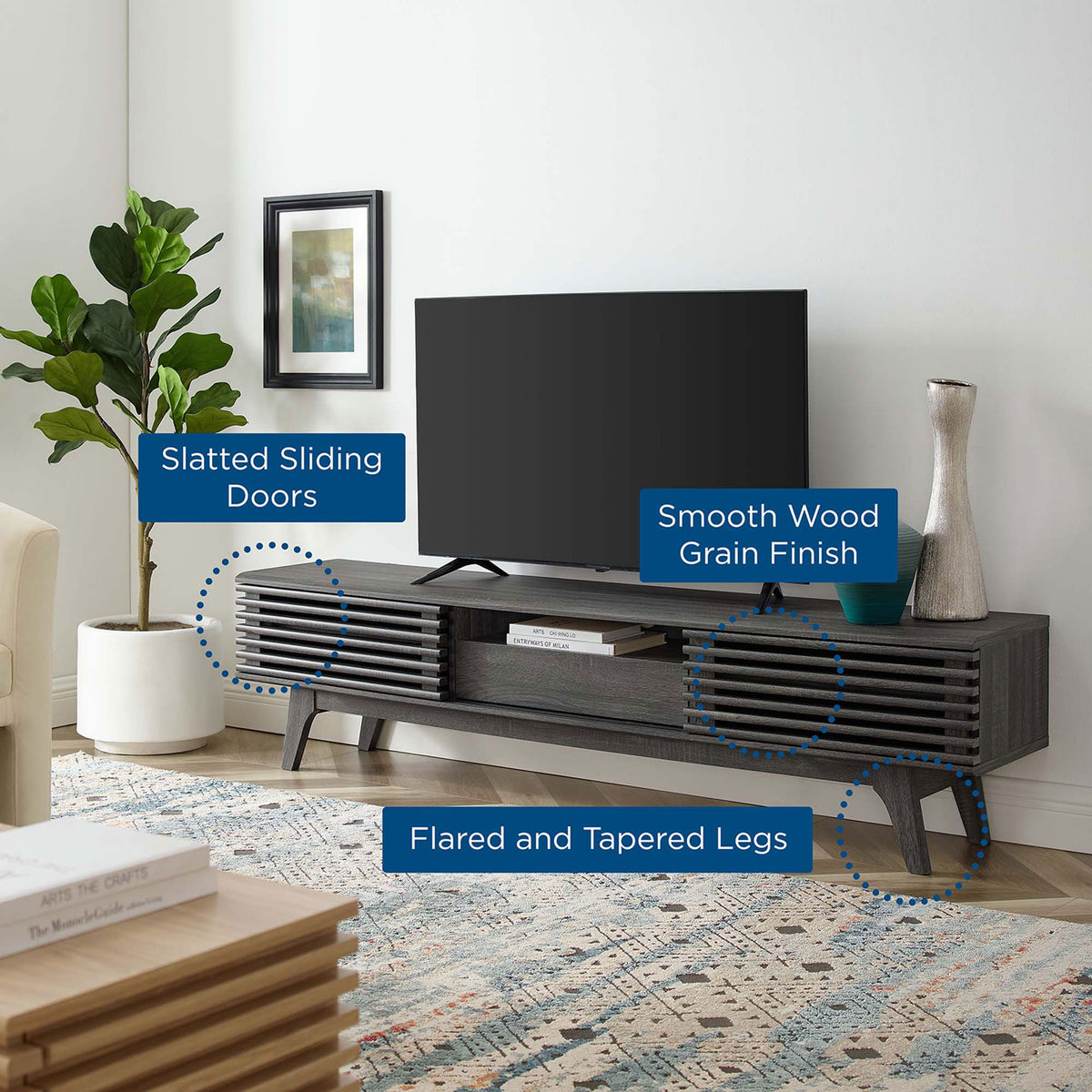 Feature callouts highlighting slatted sliding doors, smooth wood grain finish, and tapered legs on charcoal TV stand || EEI-3305-CHA || callout_room