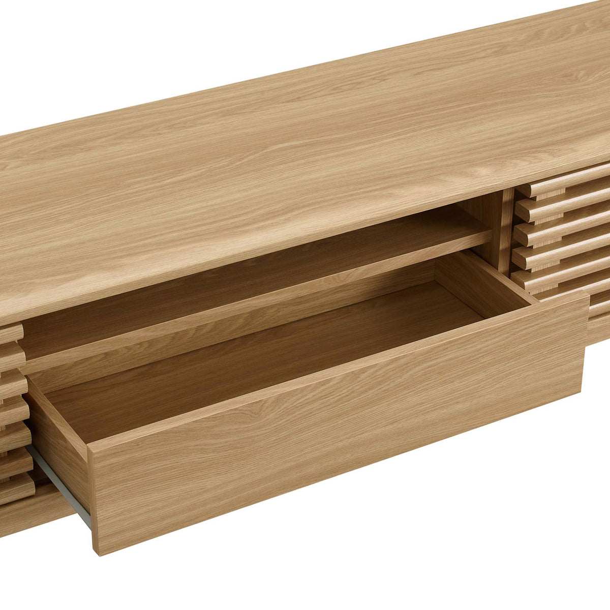 Open center drawer and shelf of oak TV stand displaying easy-access storage space || EEI-3305-OAK || storage_open_studio
