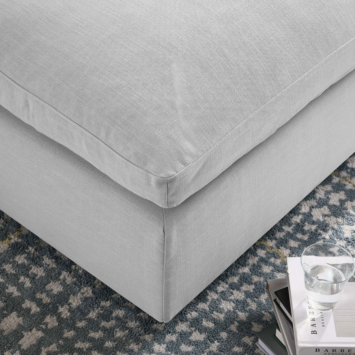 Soft linen-textured upholstery and plush cushion corner promise cozy comfort for everyday lounging. || EEI-3318-LGR || detail_room