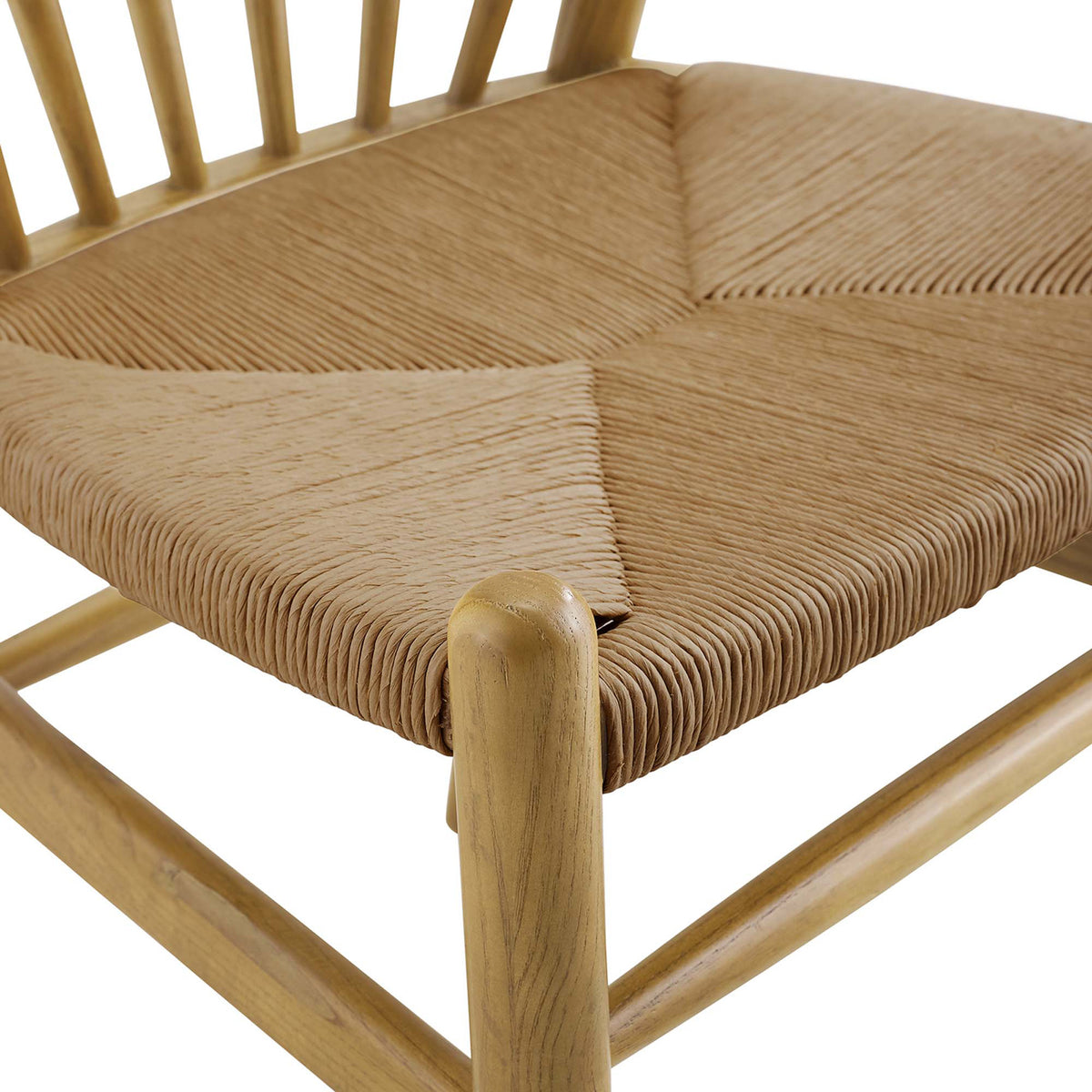 Woven paper rope forms a richly textured seat beside the warm grain of the natural wood frame