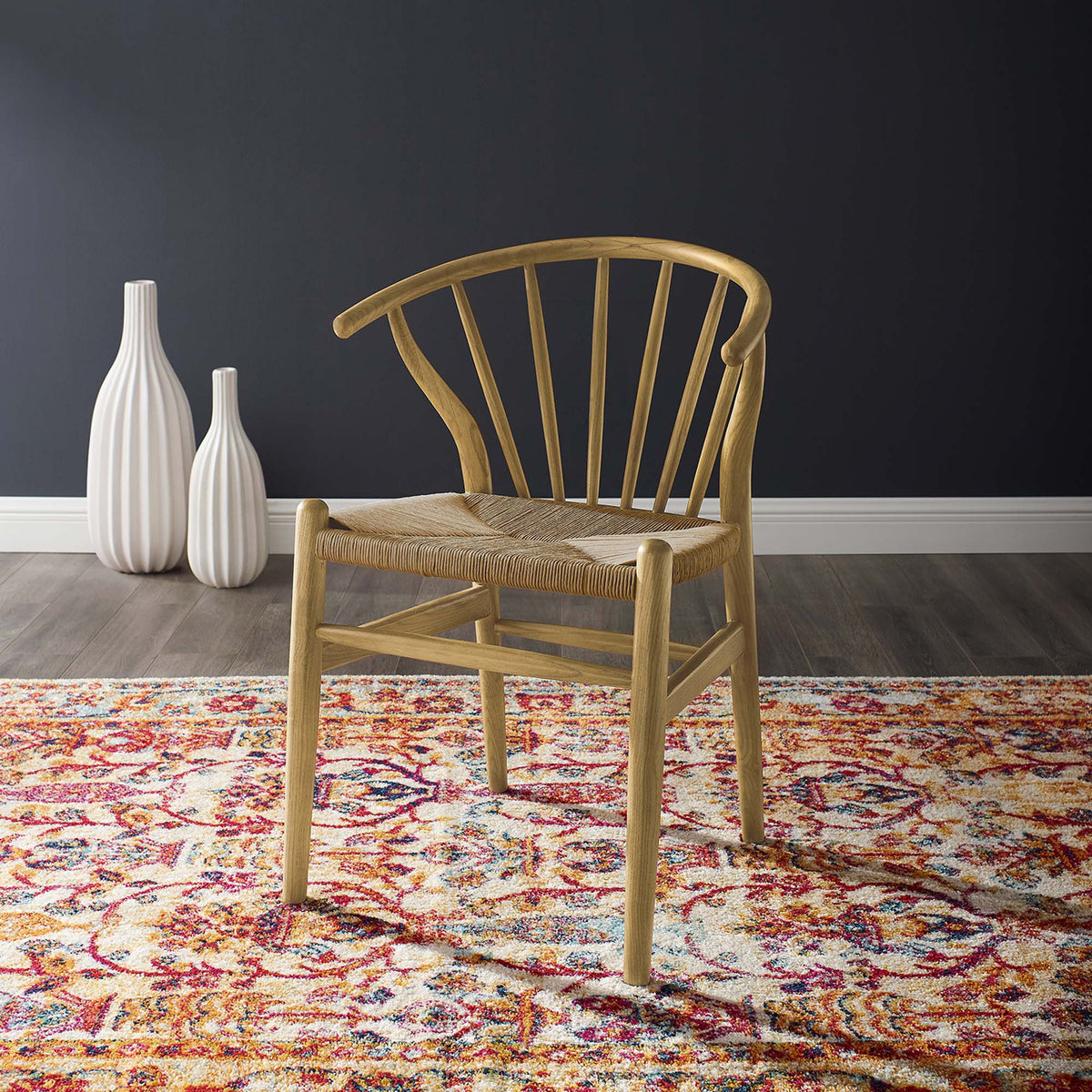 Natural wood and a tan woven seat bring organic warmth to a softly curved dining chair