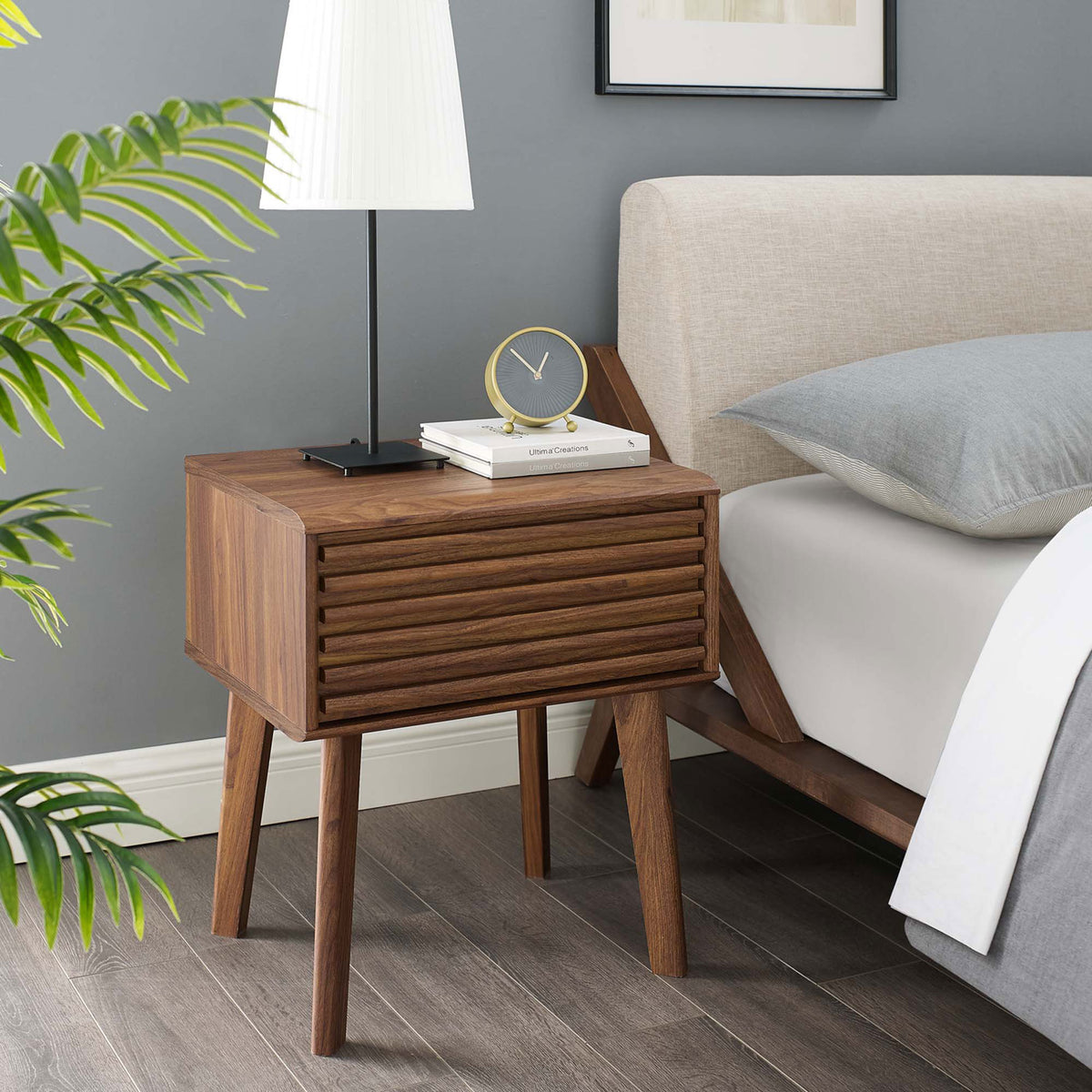 Render walnut nightstand next to bed brings mid-century warmth with slatted drawer and tapered legs || EEI-3345-WAL || front_angle_room