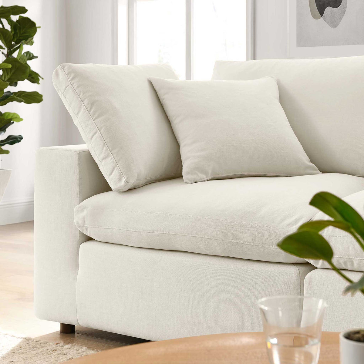 Oversized light beige seat and back cushions offer an easygoing, sink-in feel