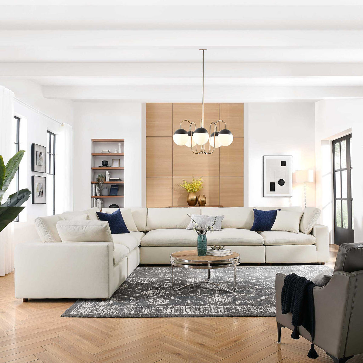 An expansive light beige sectional creates a soft, welcoming place to gather.