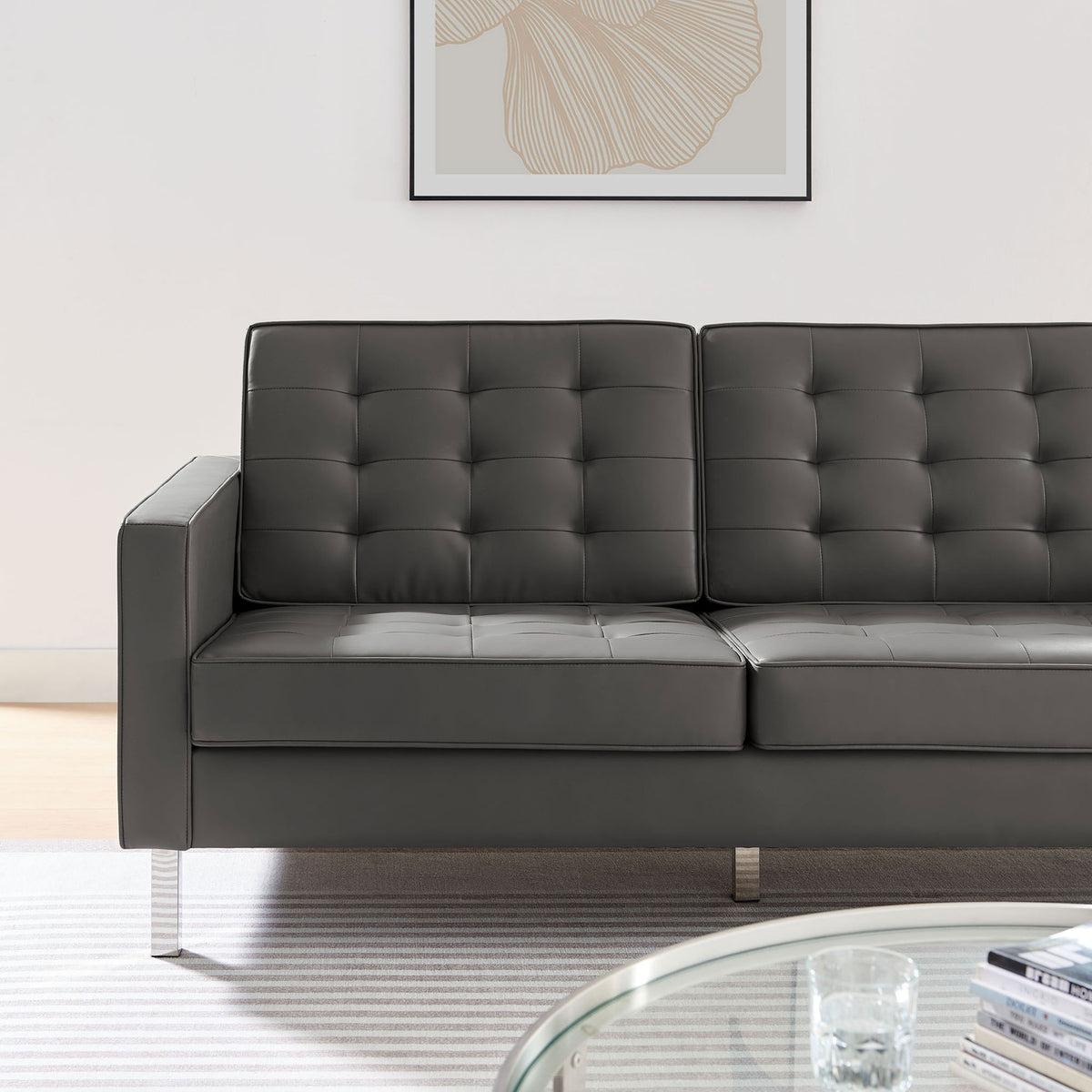 Tufted gray vegan leather sofa styled with modern decor and soft natural light in a bright living space || EEI-3385-SLV-GRY || detail_room