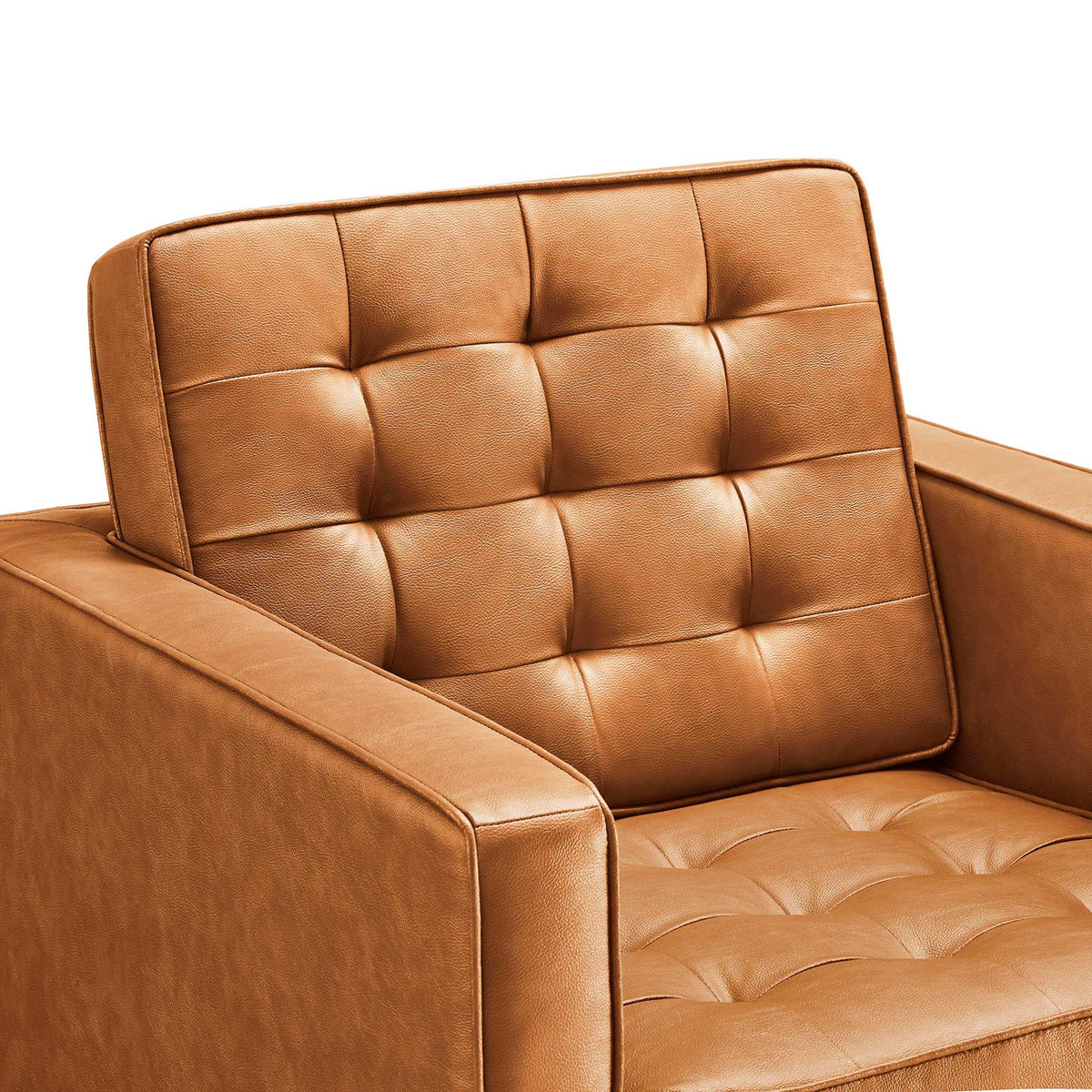 Rich tan vegan leather and pillowy biscuit tufting bring inviting texture to the back and seat.