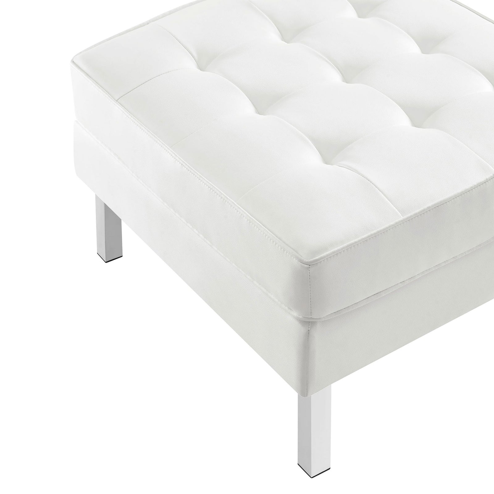 Tufted white vegan leather cushion and gleaming stainless steel leg of the ottoman || EEI-3394-SLV-WHI || detail_studio