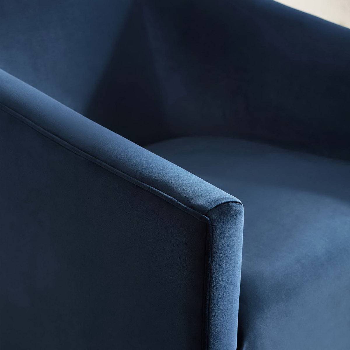 Tight upholstery and neat piping showcase craftsmanship on the barrel-arm silhouette. || EEI-3456-MID || detail_studio