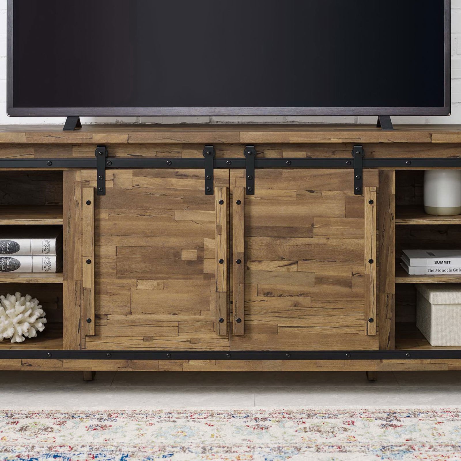 Farmhouse TV stand in walnut finish styled in a living room with TV and decor on adjustable shelves || EEI-3489-WAL || storage_room