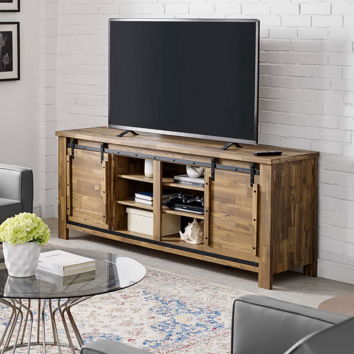 Walnut barn door TV stand in modern living room showing full length design and open storage || EEI-3489-WAL || front_angle_room