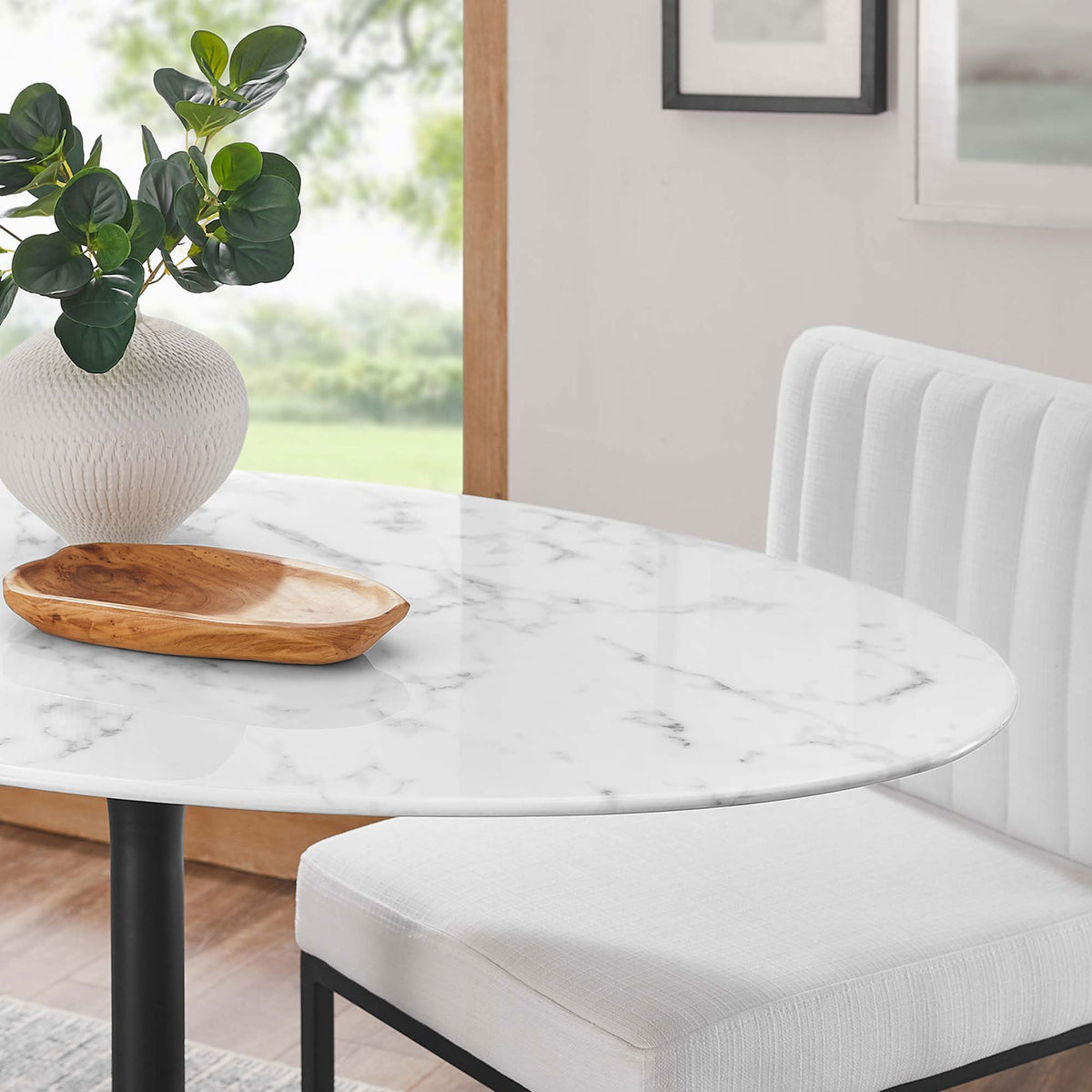 Glossy faux marble tabletop adds a bright, modern touch to a cozy dining nook in the Lippa 48 inch table || EEI-3518-BLK-WHI || detail_room