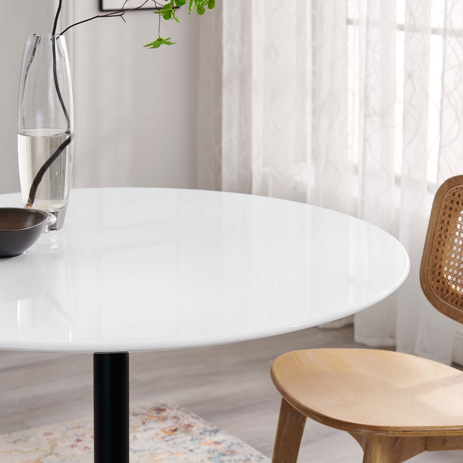 Glossy white tabletop styled with glass vase and mug brings light, airy elegance to the room || EEI-3521-BLK-WHI || detail_room