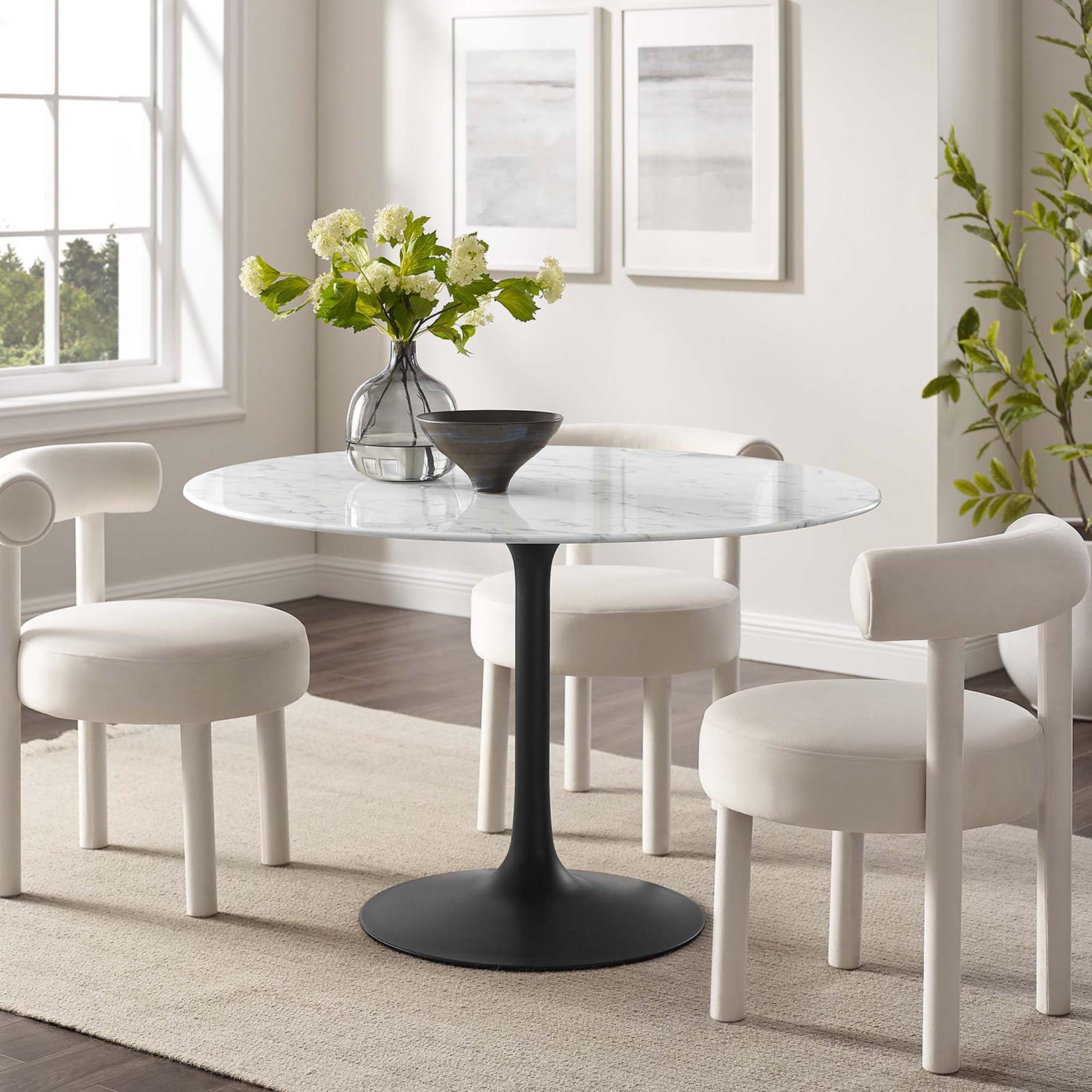 48 inch round faux marble dining table styled with three modern white chairs in a bright room || EEI-3527-BLK-WHI || front_angle_room