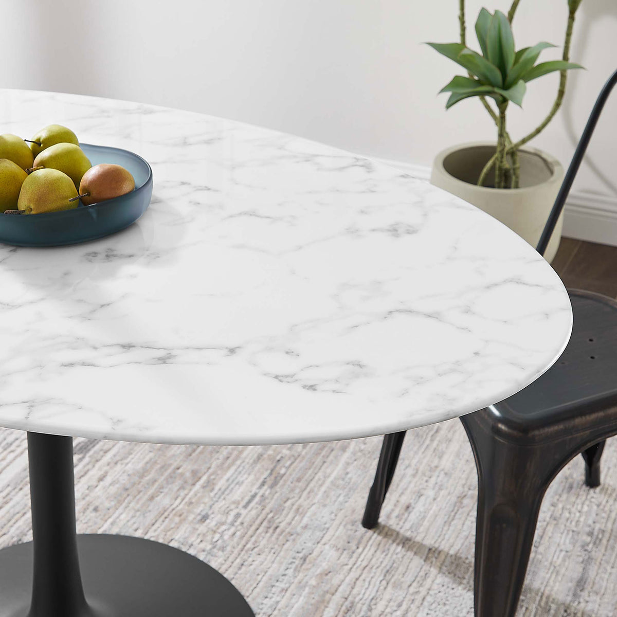 Smooth faux marble tabletop of the Lippa 54 inch table brings modern polish to a relaxed dining corner || EEI-3530-BLK-WHI || detail_room