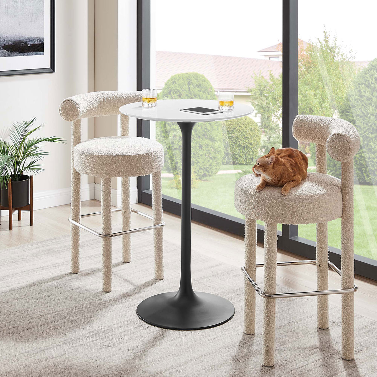Compact pedestal table anchors a cozy nook with airy, modern style that pairs easily with stools || EEI-3545-BLK-WHI || front_room