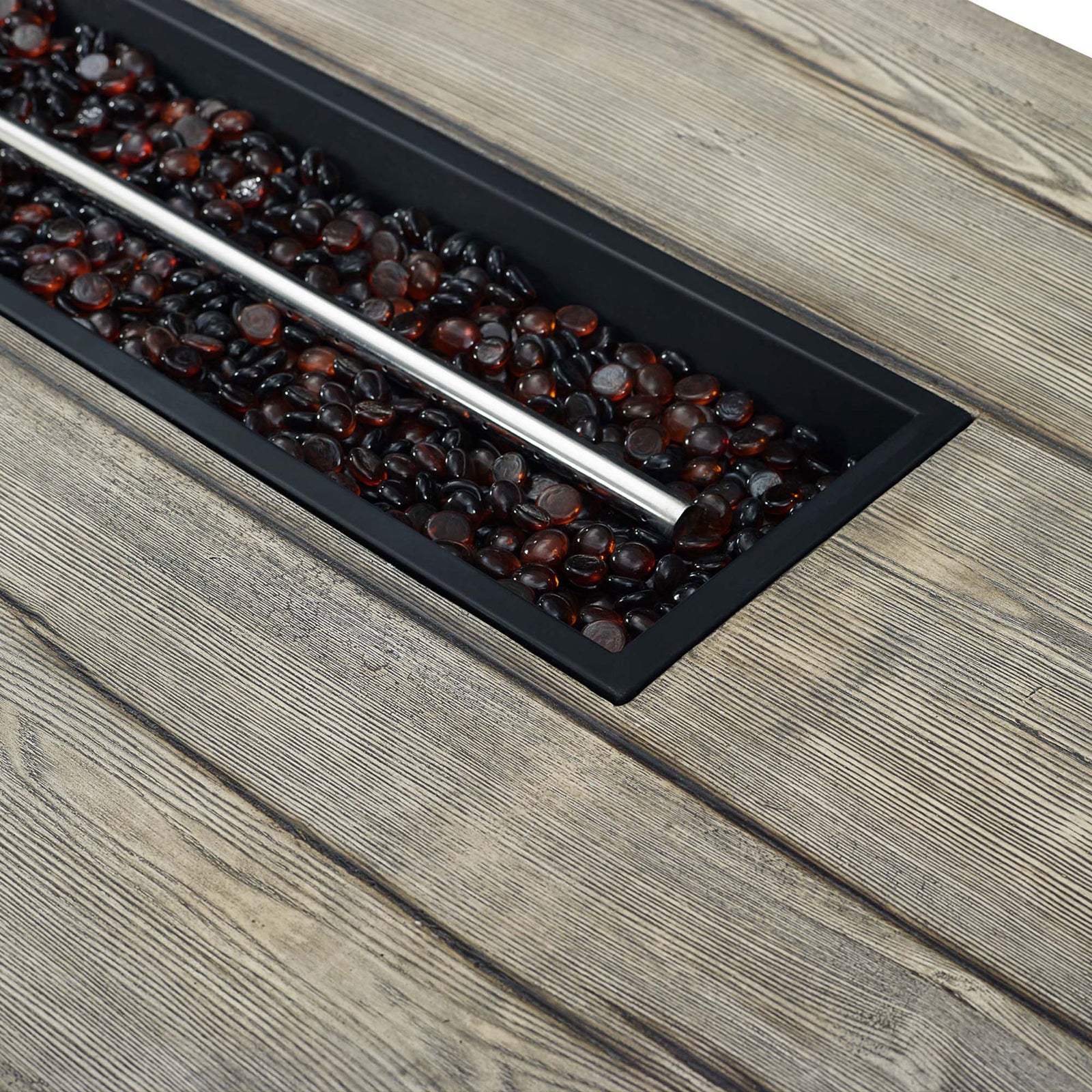 Tempered glass beads surrounding the stainless steel burner bar on the Manteo fire pit tabletop || EEI-3563-LGR || detail_studio