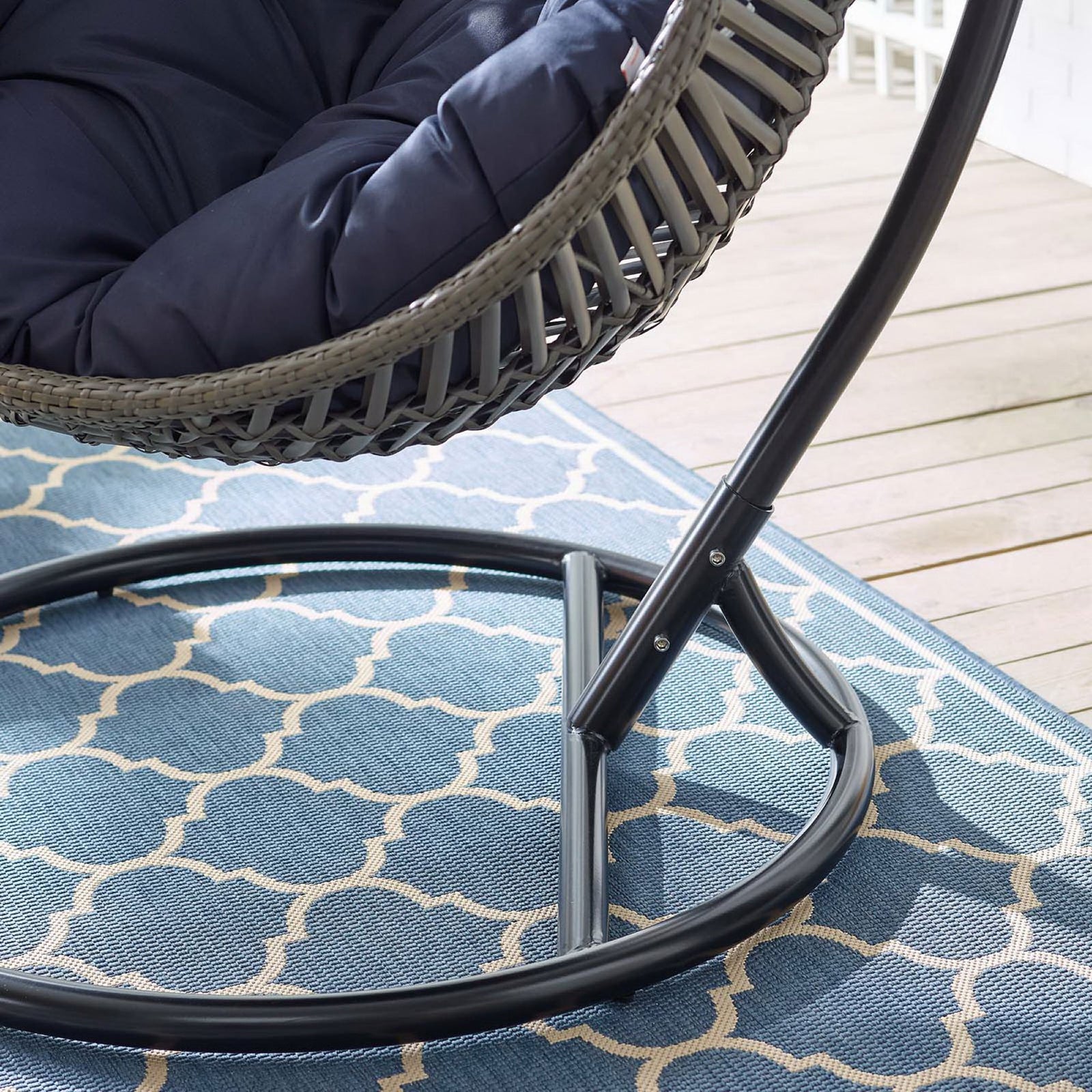 Navy cushion and stable metal base underscoring the chair's plush comfort and sturdy construction. || EEI-3614-GRY-NAV || detail_room