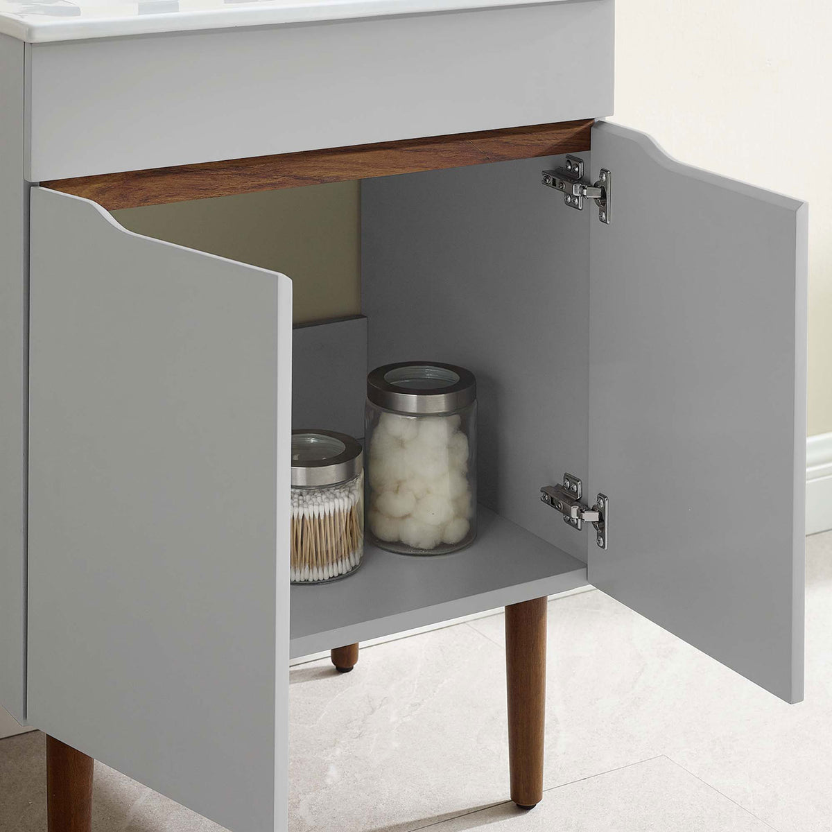 Cabinet interior fits everyday items neatly, with soft-close doors for quiet convenience || EEI-3633-GRY-WHI || storage_open_room