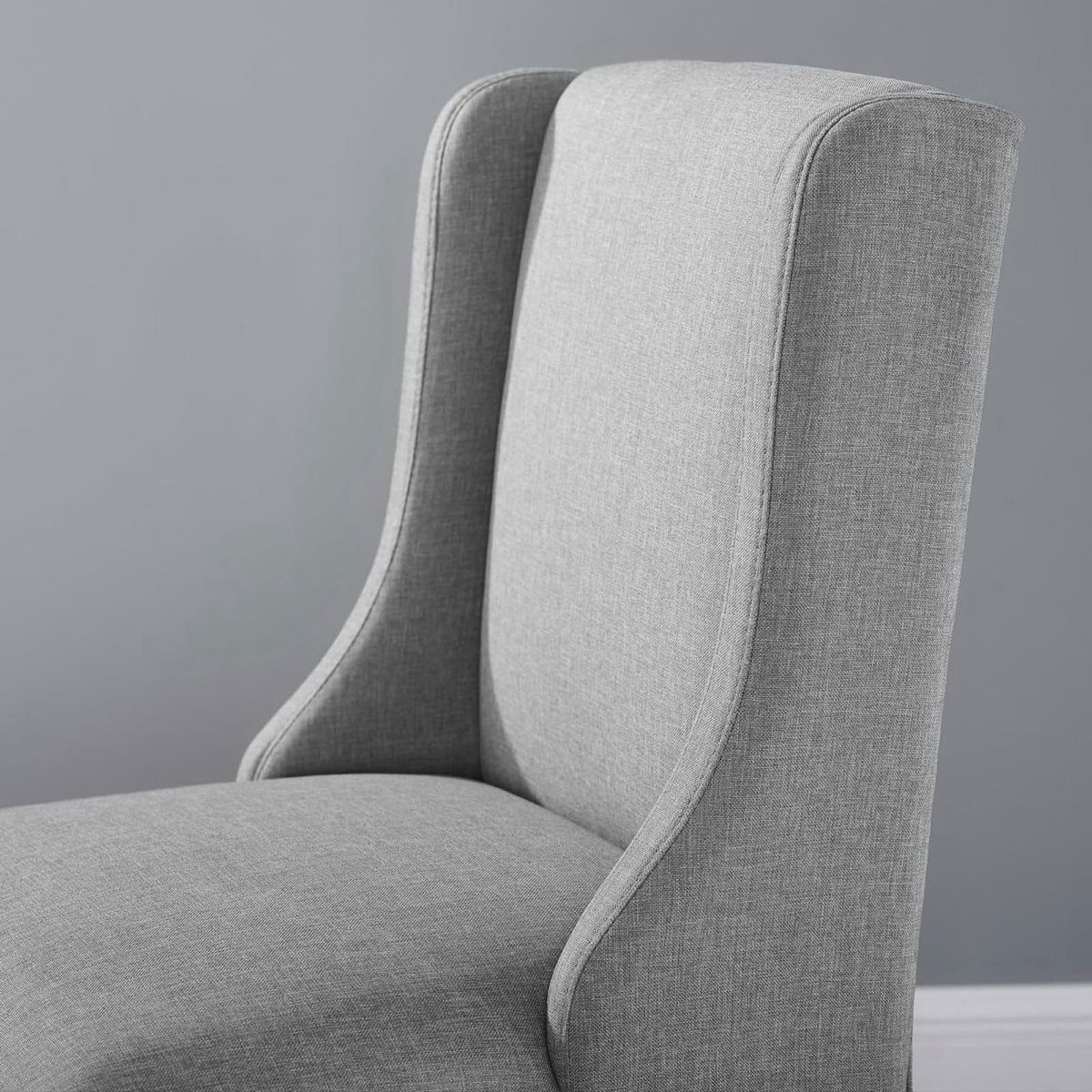Textured light gray fabric and smooth piping add a refined touch to the supportive backrest. || EEI-3735-LGR || detail_room
