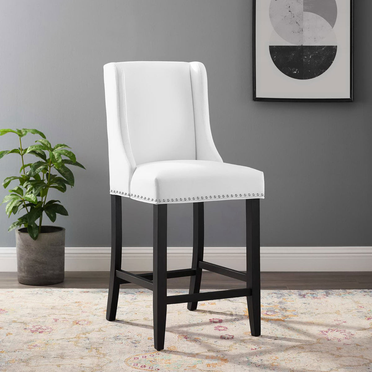 Chic counter stool elevates the kitchen with crisp white upholstery and dark wood legs || EEI-3736-WHI || front_angle_room