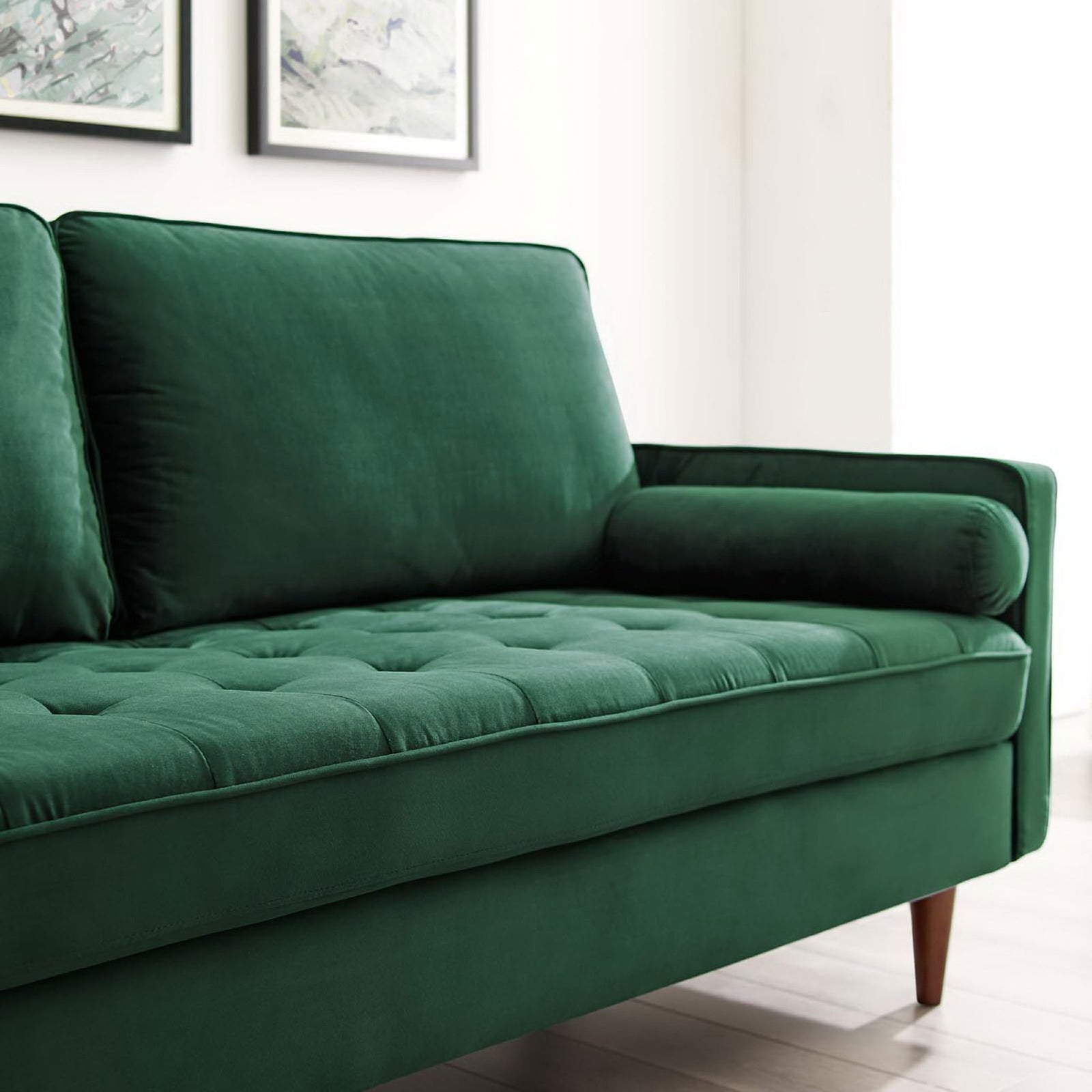Green Valour sofa adds cozy comfort with its tufted seat and bolster pillow in a bright modern room || EEI-3764-GRN || detail_room