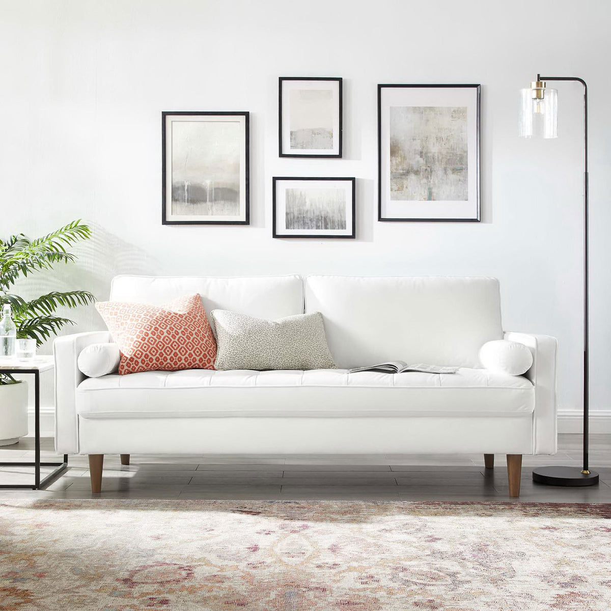 White velvet sofa styled in a bright living room with accent pillows, rug, and floor lamp || EEI-3764-WHI || front_room