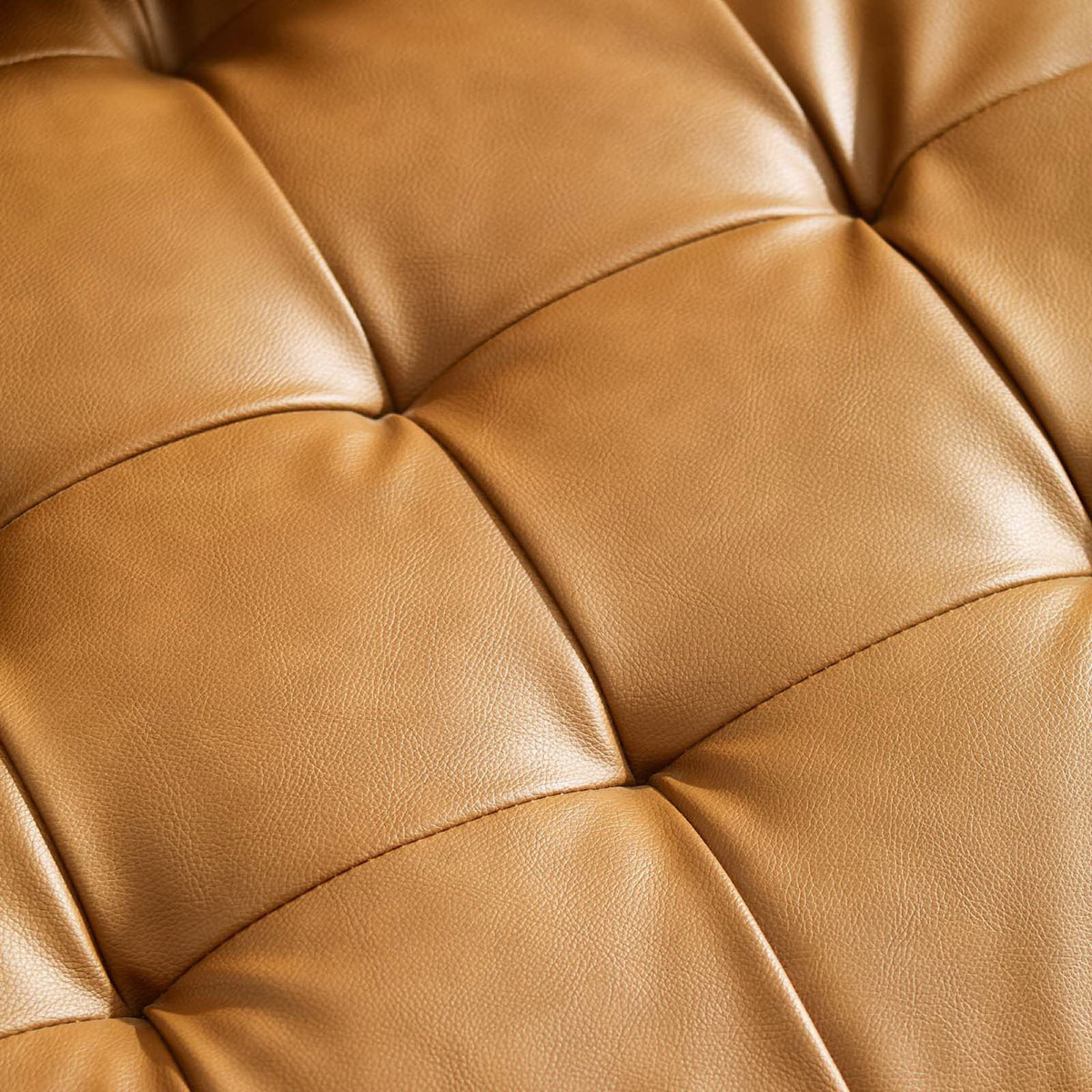 Detailed look at tan faux leather upholstery with soft grain texture and biscuit tufting || EEI-3765-TAN || swatch_studio